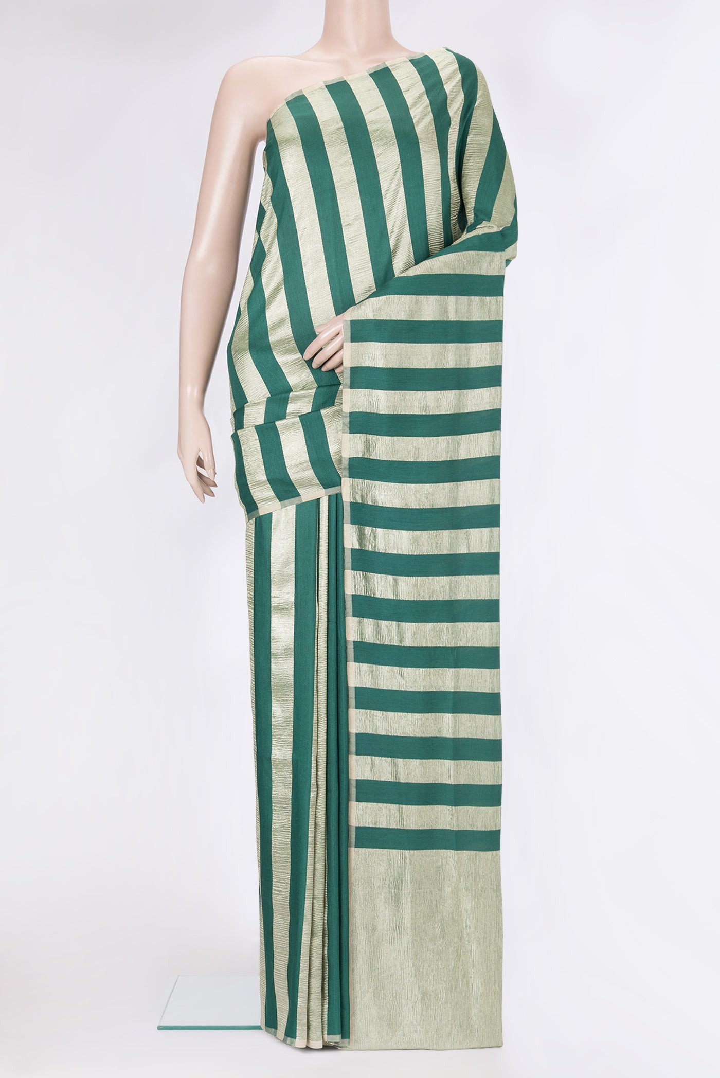 Green Tussar Silk Saree with Stripes on the body and Zari Border.  displayed on a mannequin