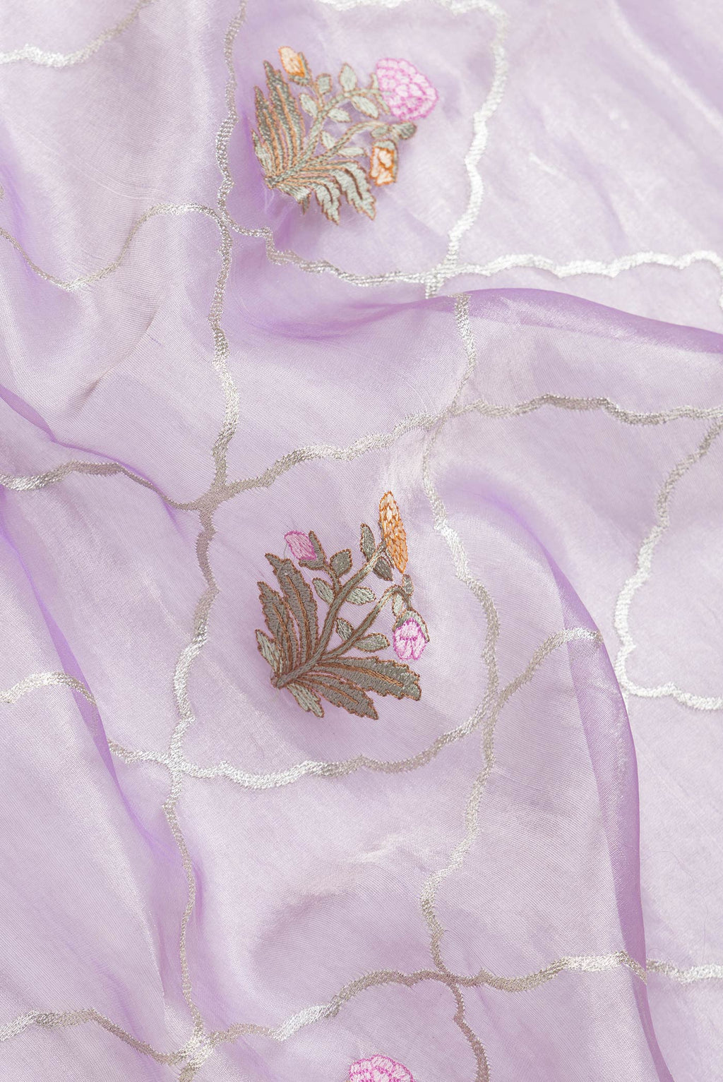 Close up of Lavender Dual Tone Organza Silk Saree with Zari Brocade on the body and Zari Border.  displaying folds