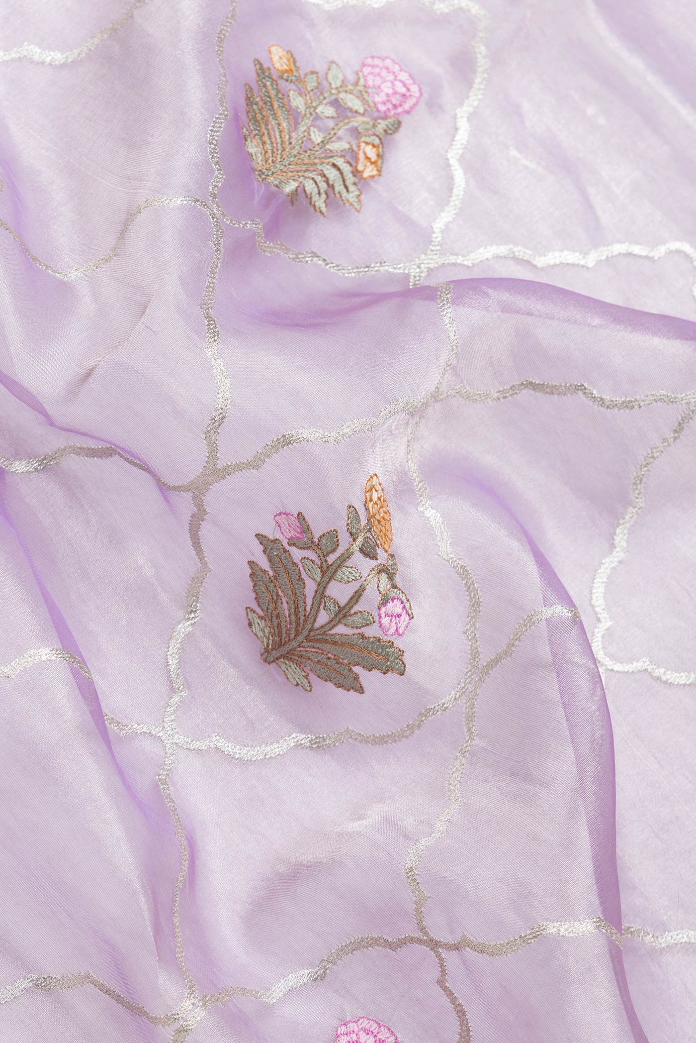 Close up of Lavender Dual Tone Organza Silk Saree with Zari Brocade on the body and Zari Border.  displaying folds