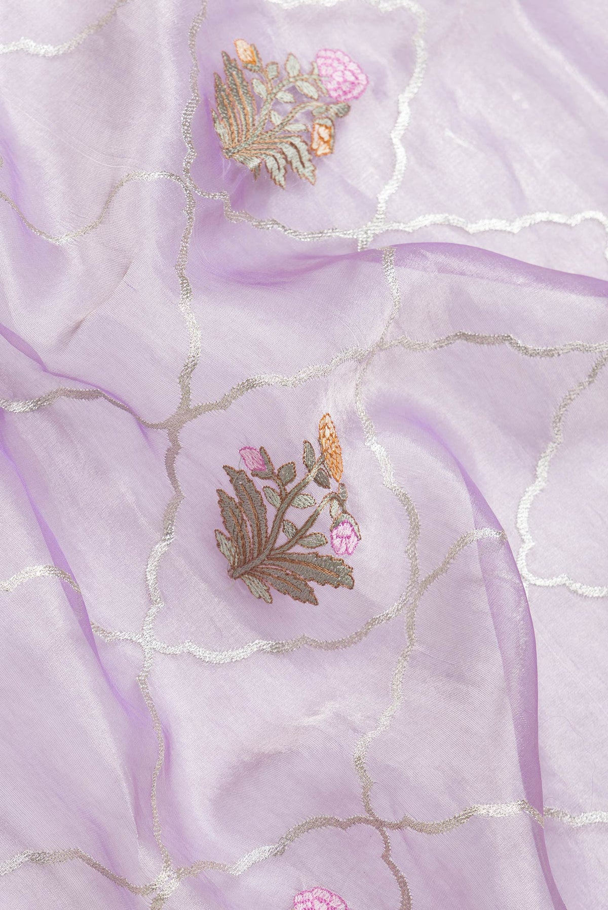 Close up of Lavender Dual Tone Organza Silk Saree with Zari Brocade on the body and Zari Border.  displaying folds