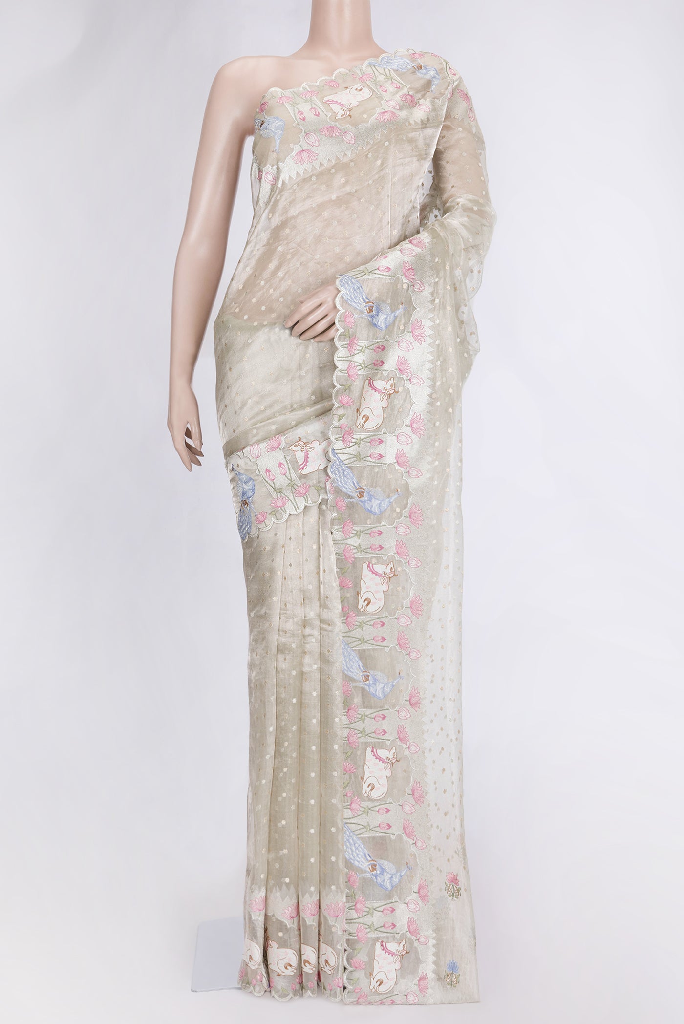 Pista Green Dual Tone Organza Silk Saree with Zari Butta on the body and Fancy Border.  displayed on a mannequin