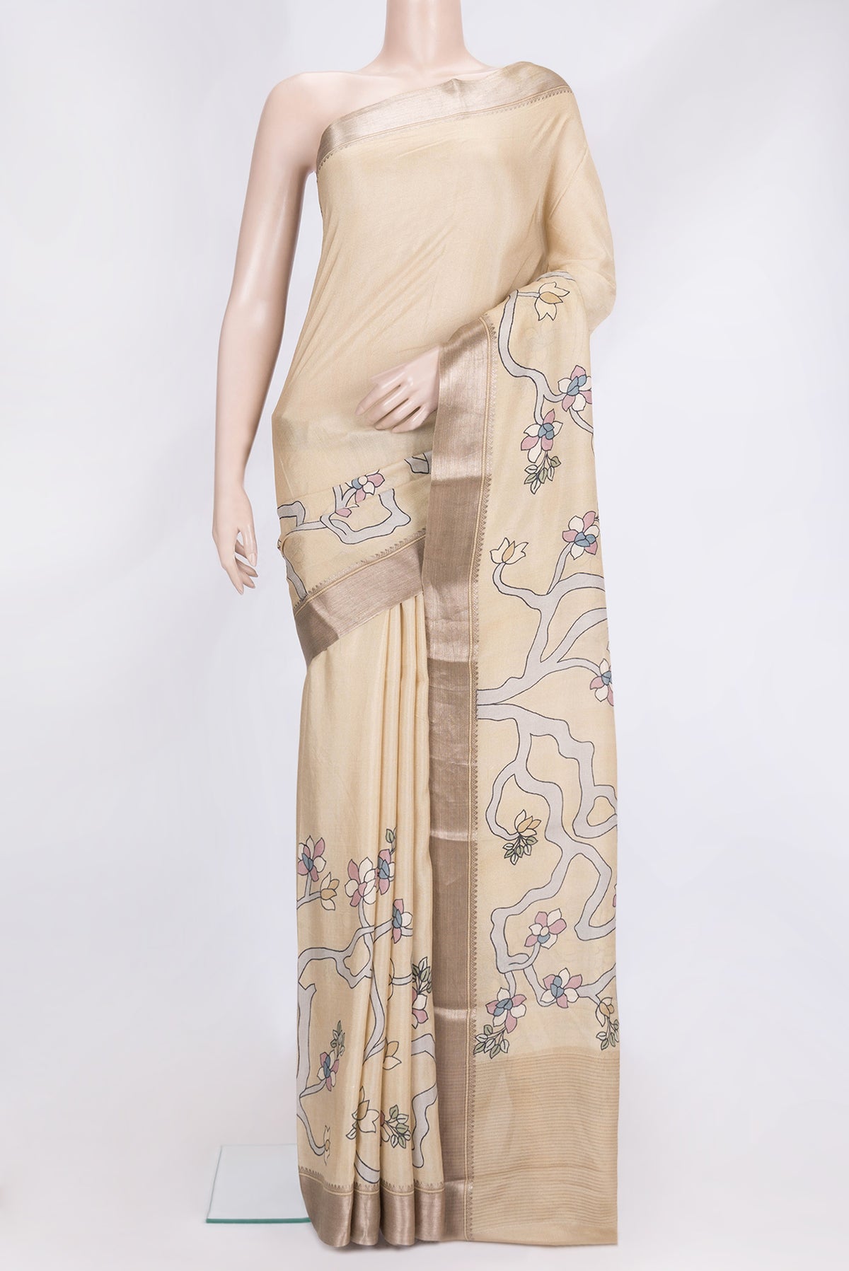 Beige Dual Tone Tussar Silk Saree with Printed design on the body and Zari Border.  displayed on a mannequin