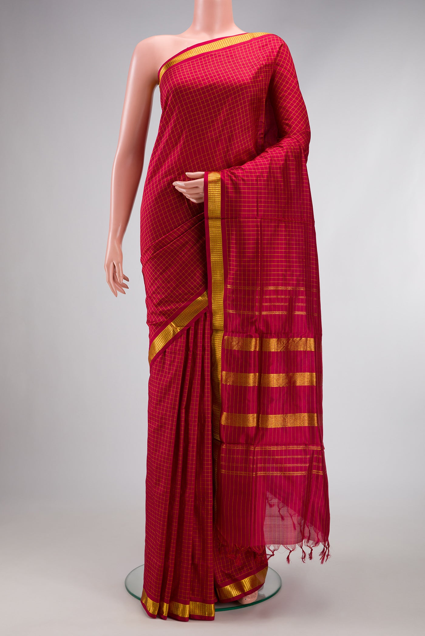 Maroon Kanchipuram Silk Nine Yards Saree with Checked design on the body and Zari Border.  displayed on a mannequin