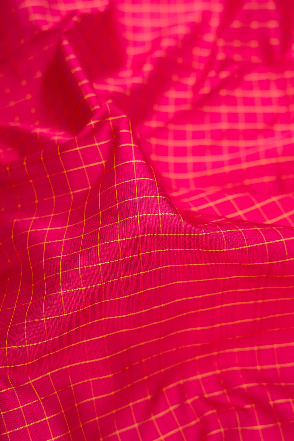 Close up of Pure Silk Pure Zari Maroon Dual Tone Kanjivaram Nine Yards Saree with Checked design on the body and Zari Border.  displaying folds