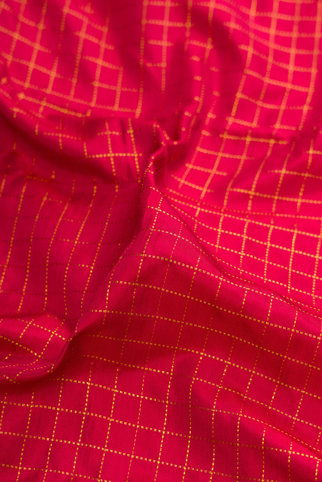 Close up of Maroon Kanjivaram Silk Nine Yards Saree with Checked design on the body and Zari Border.  displaying folds