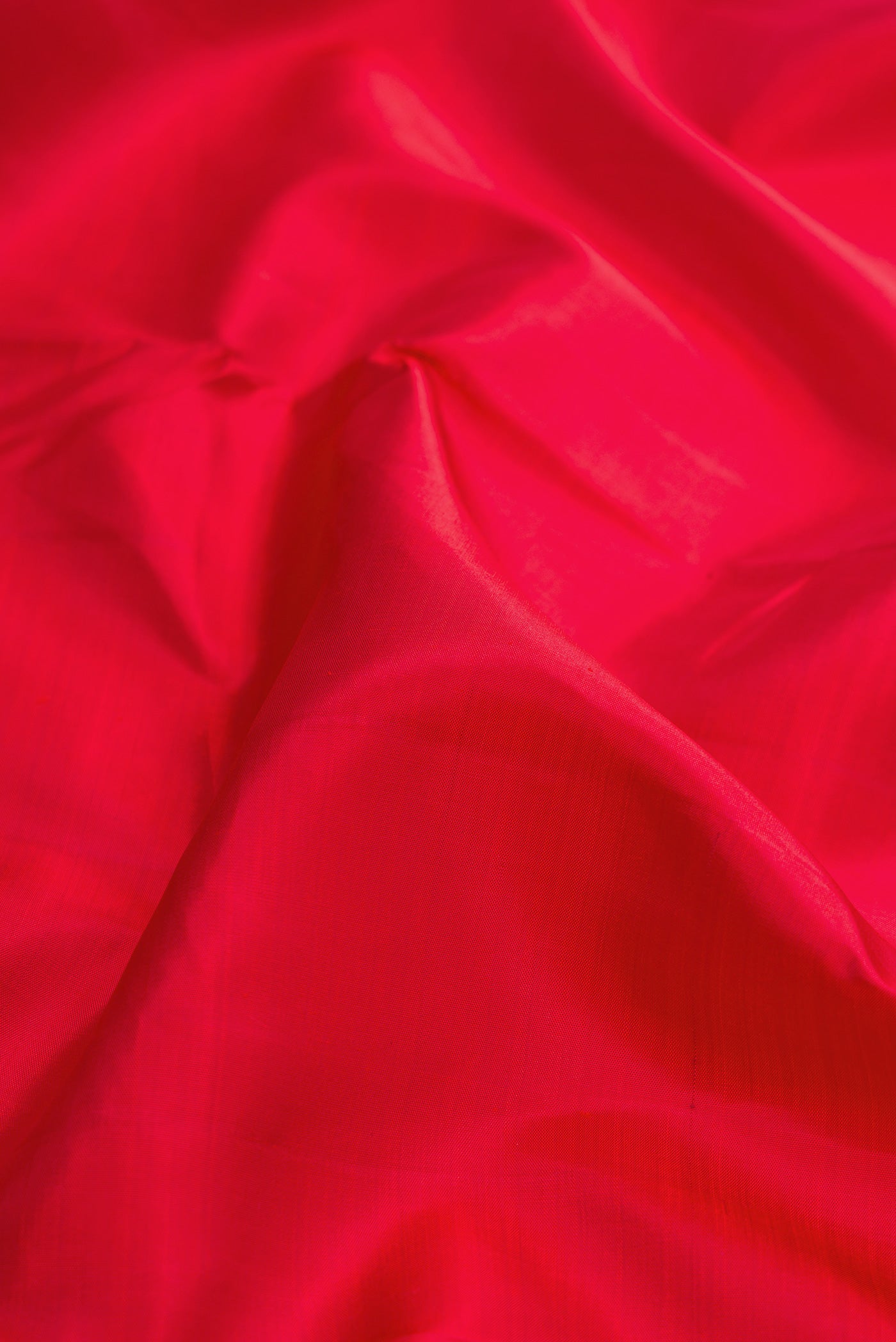 Close up of Pure Silk Pure Zari Red Dual Tone Kanjivaram Nine Yards Saree with Plain Body and Zari Border.  displaying folds