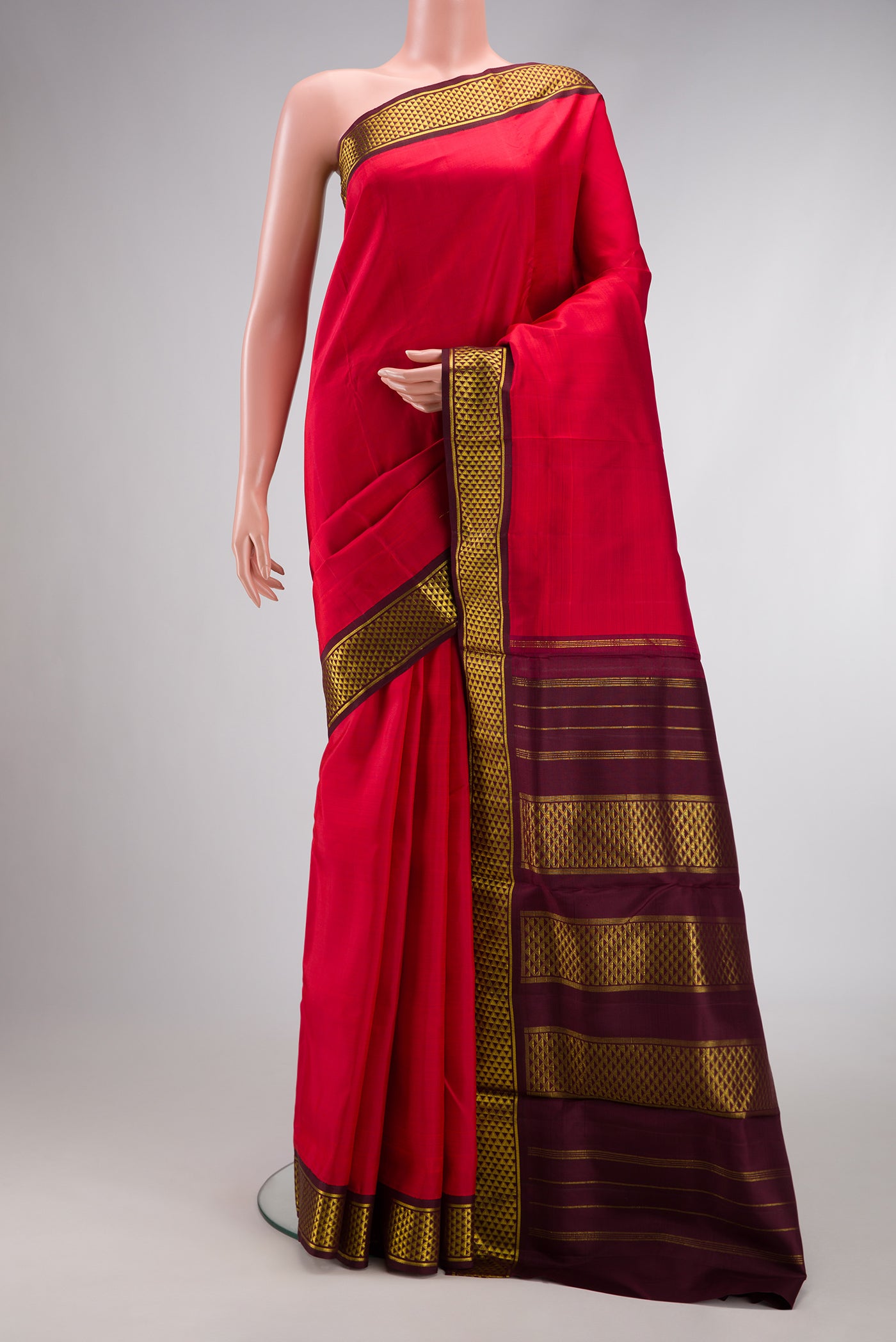 Pure Silk Pure Zari Red Dual Tone Kanjivaram Nine Yards Saree with Plain Body and Zari Border.  displayed on a mannequin