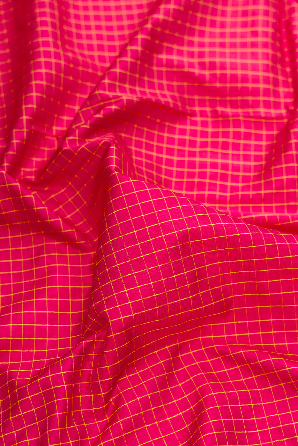 Close up of Maroon Dual Tone Kanchipuram Silk Nine Yards Saree with Checked design on the body and Zari Border.  displaying folds