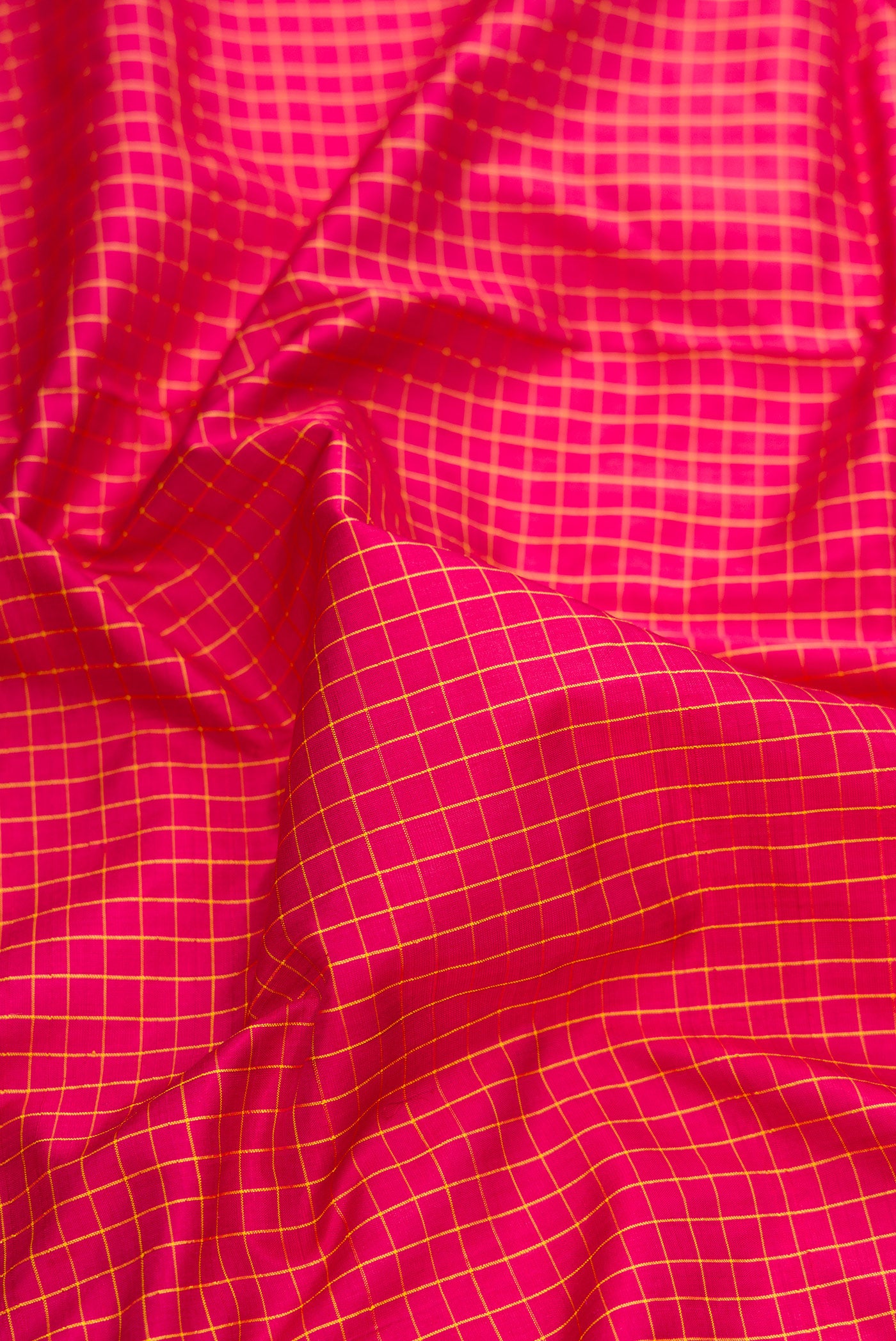 Close up of Maroon Dual Tone Kanchipuram Silk Nine Yards Saree with Checked design on the body and Zari Border.  displaying folds