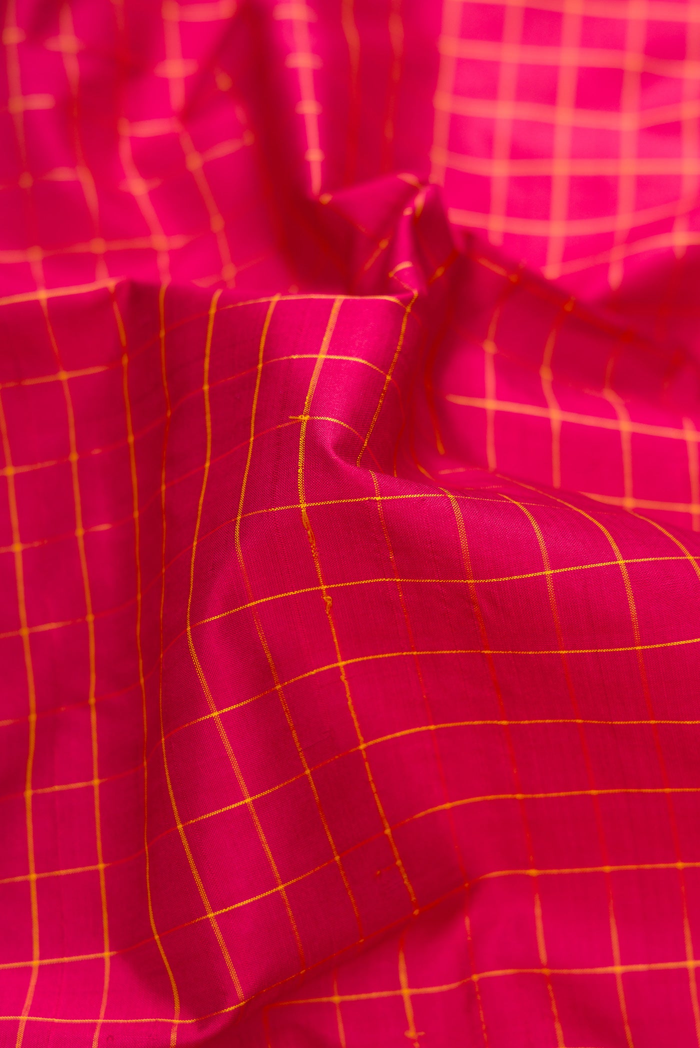 Close up of Pure Silk Pure Zari Maroon Dual Tone Kanchipuram Nine Yards Saree with Checked design on the body and Zari Border.  displaying folds