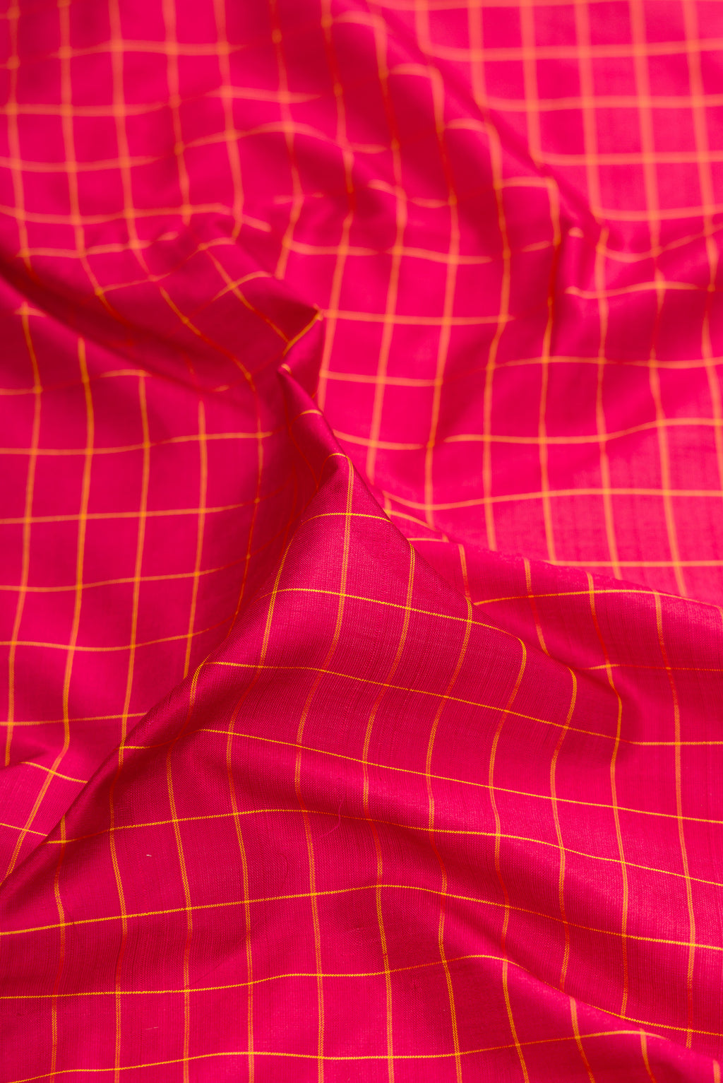 Close up of Maroon Kanchipuram Silk Nine Yards Saree with Checked design on the body and Zari Border.  displaying folds