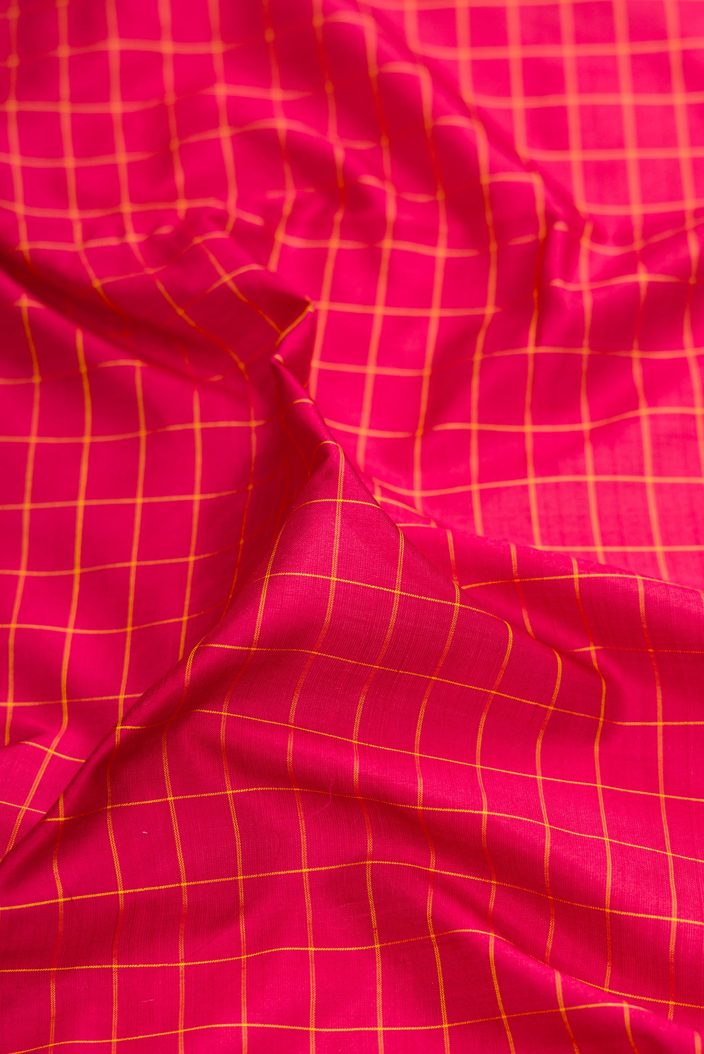 Close up of Maroon Kanchipuram Silk Nine Yards Saree with Checked design on the body and Zari Border.  displaying folds
