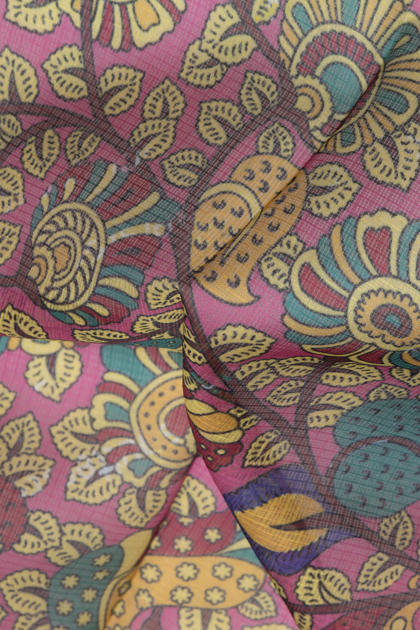 Close up of Pink Kota Silk Saree with Printed design on the body and Zari Border.  displaying folds