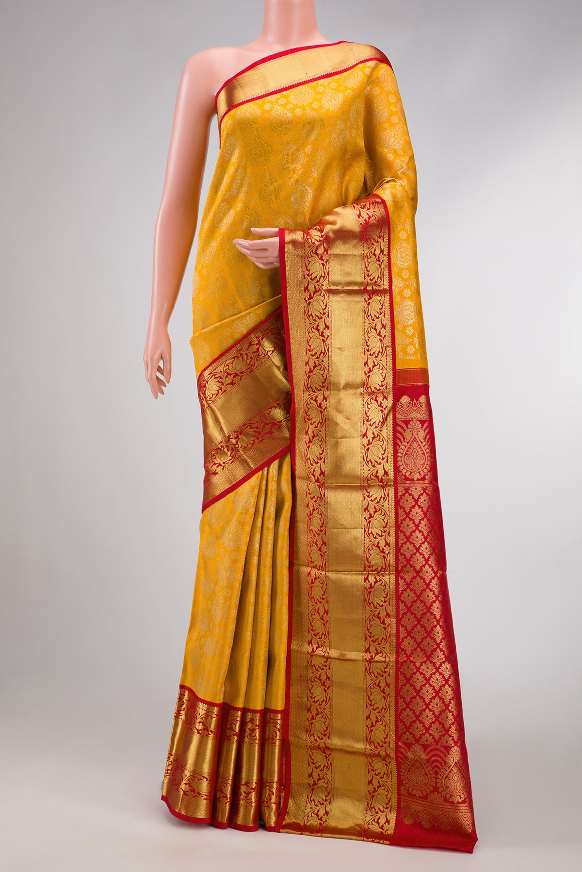 Mustard Dual Tone Kanjivaram Silk Saree with Zari Brocade on the body and Zari Border.  displayed on a mannequin