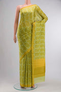 Green Printed Silk SareePrinted design on the body and Plain Border displayed on a mannequin