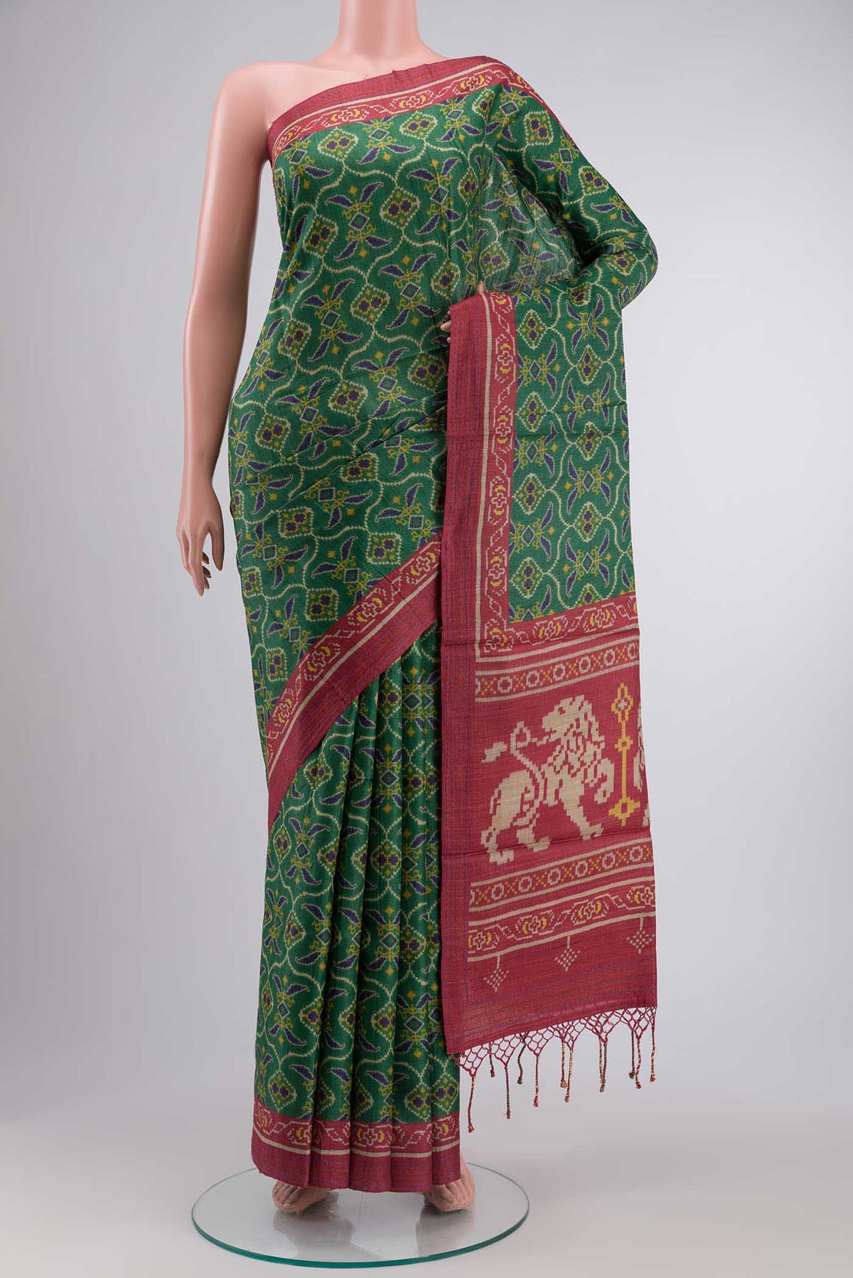 Green Tussar Silk SareePrinted design on the body and Thread Border displayed on a mannequin