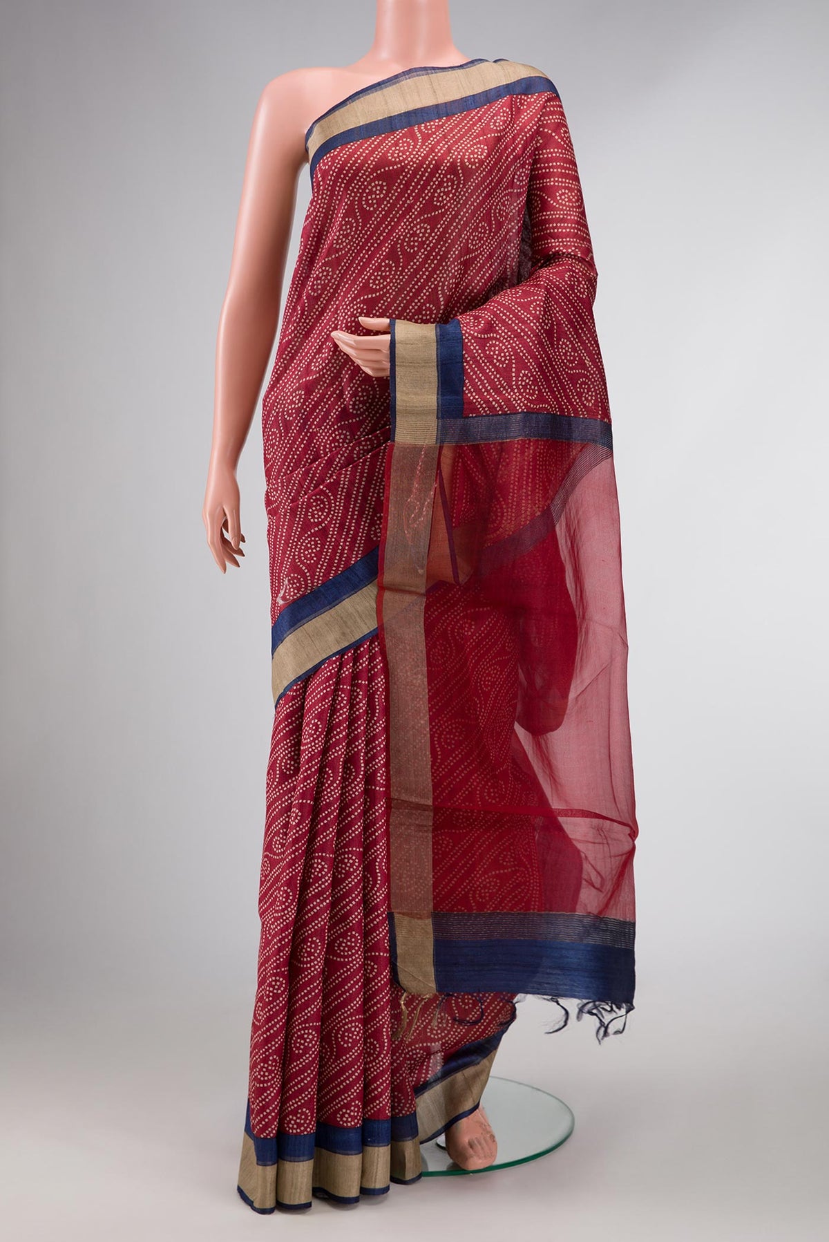 Dark Pink Dual Tone Tussar Silk Saree with Printed design on the body and Zari Border displayed on a mannequin
