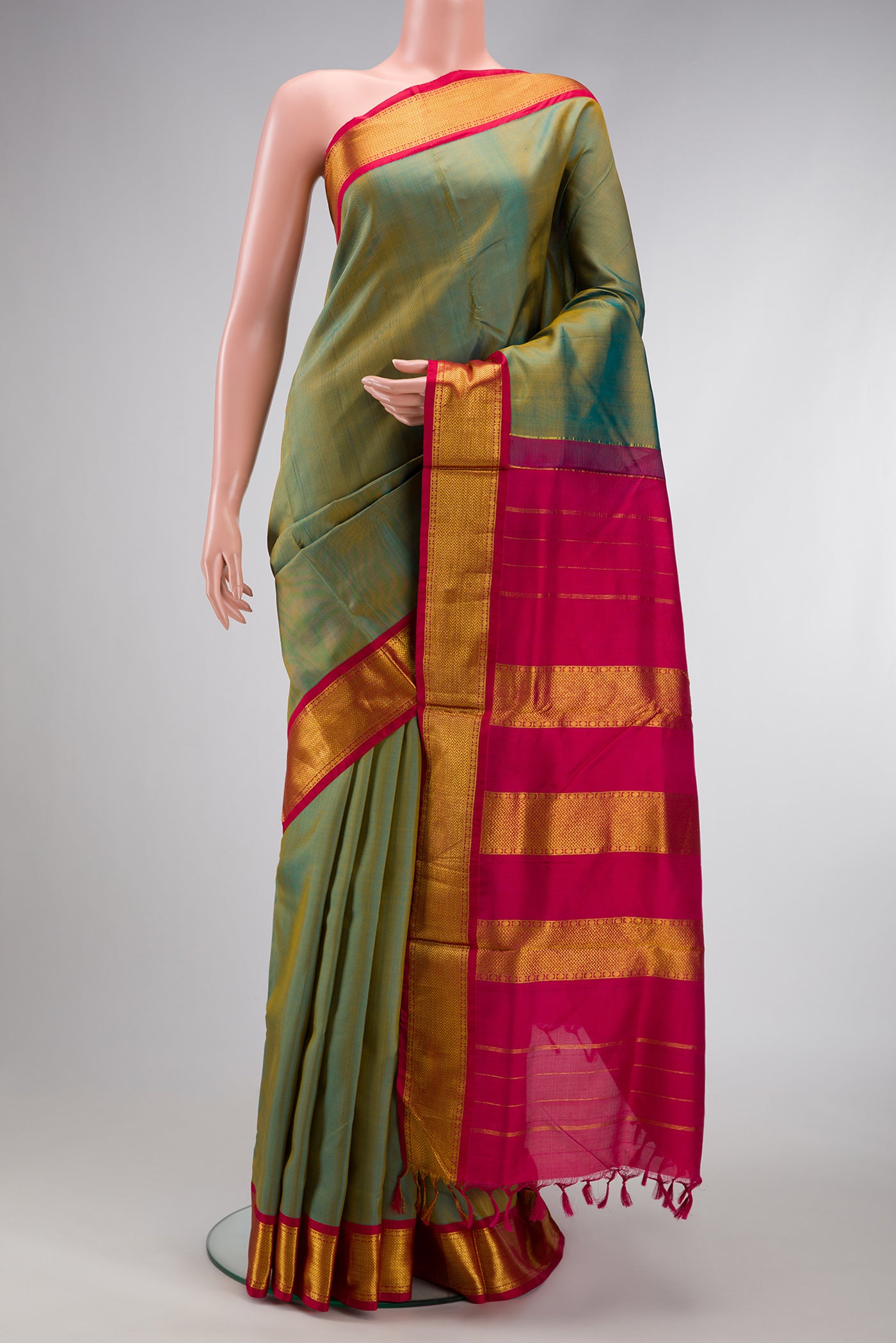 Green Dual Tone Kanjivaram Silk Nine Yards Saree with Stripes on the body and Zari Border.  displayed on a mannequin