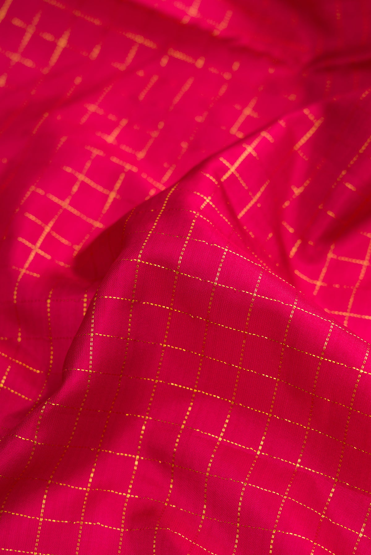 Close up of Maroon Dual Tone Kanchipuram Silk Nine Yards Saree with Checked design on the body and Zari Border.  displaying folds