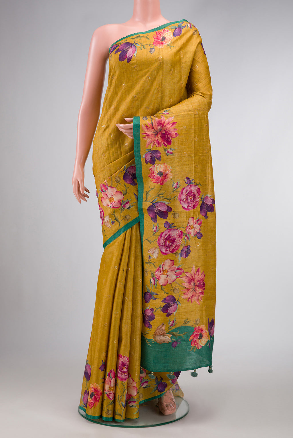 Mustard Dual Tone Tussar Silk Saree with Zari Butta on the body and Printed Border.  displayed on a mannequin