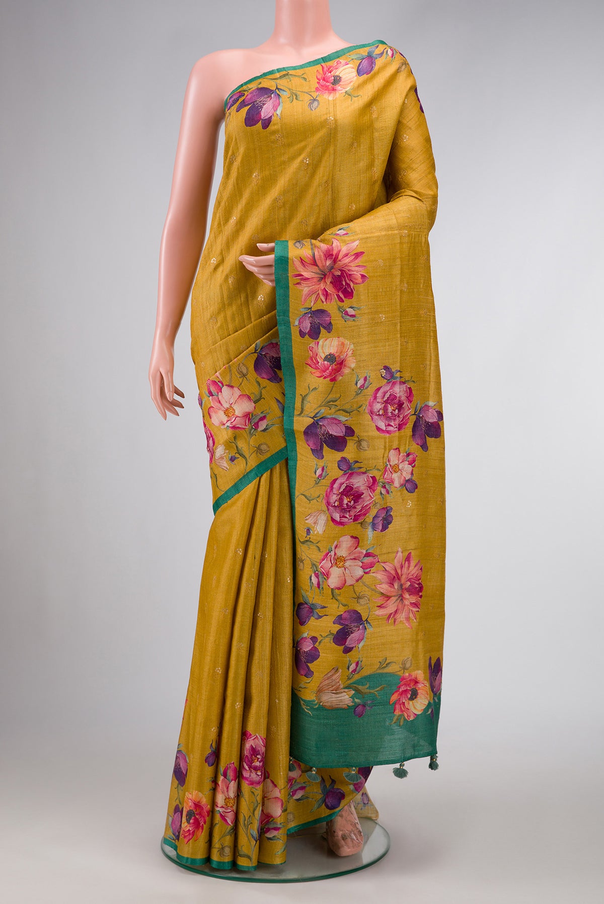 Mustard Dual Tone Tussar Silk Saree with Zari Butta on the body and Printed Border.  displayed on a mannequin