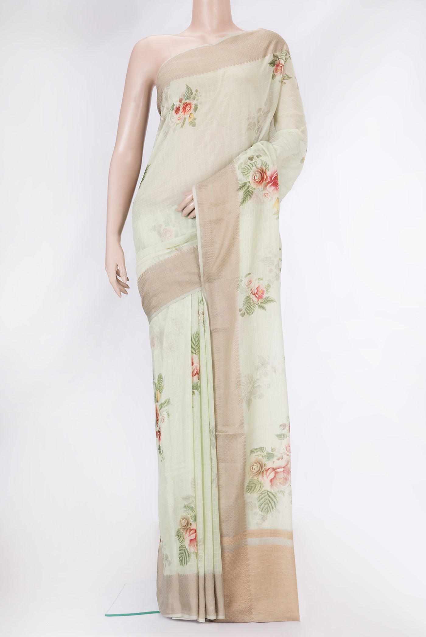 Pista Green Dual Tone Chanderi Silk Saree with Printed design on the body and Thread Border.  displayed on a mannequin