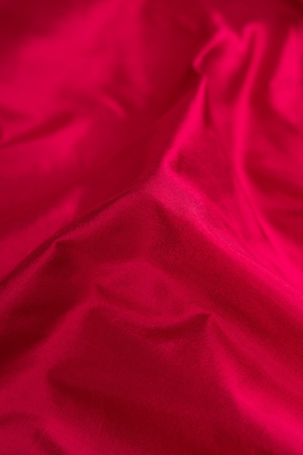 Close up of Maroon Dual Tone Kanjivaram Silk Nine Yards Saree with Plain Body and Zari Border.  displaying folds