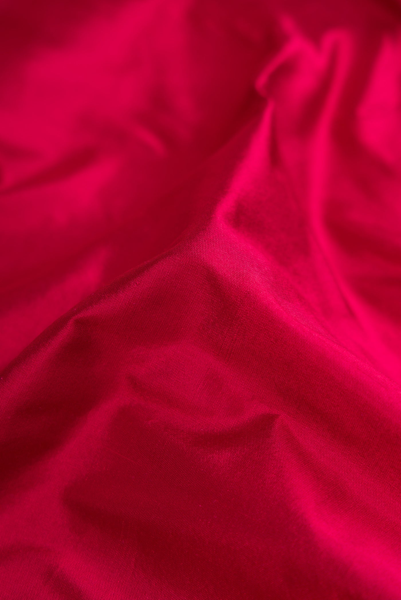 Close up of Maroon Dual Tone Kanjivaram Silk Nine Yards Saree with Plain Body and Zari Border.  displaying folds