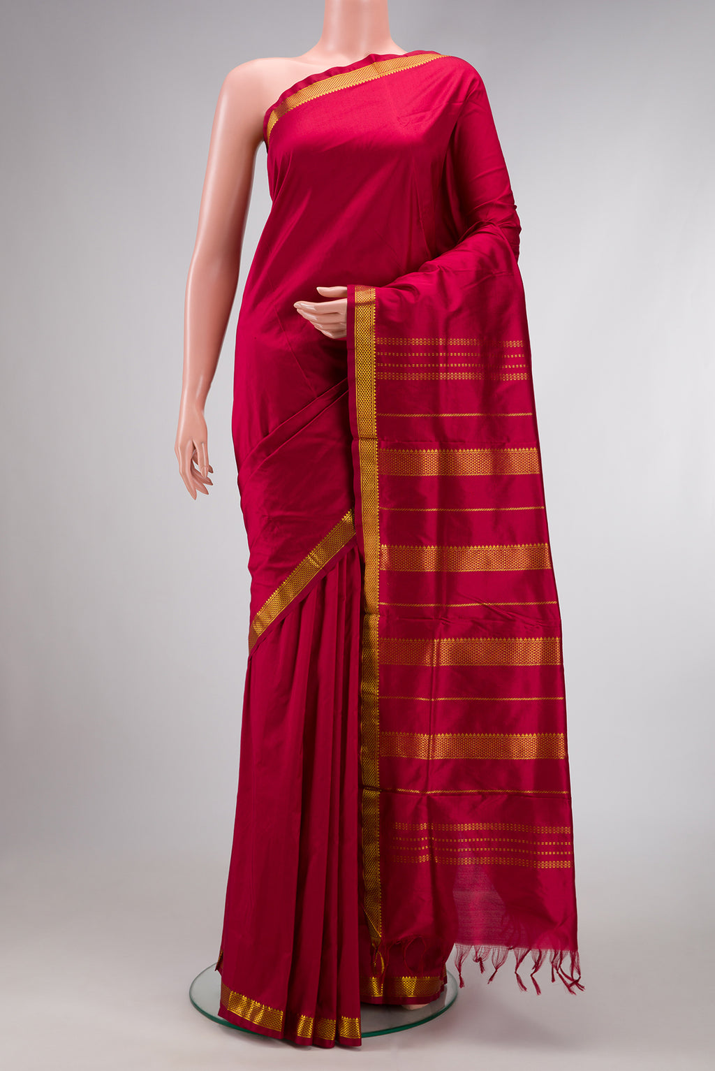 Maroon Dual Tone Kanjivaram Silk Nine Yards Saree with Plain Body and Zari Border.  displayed on a mannequin