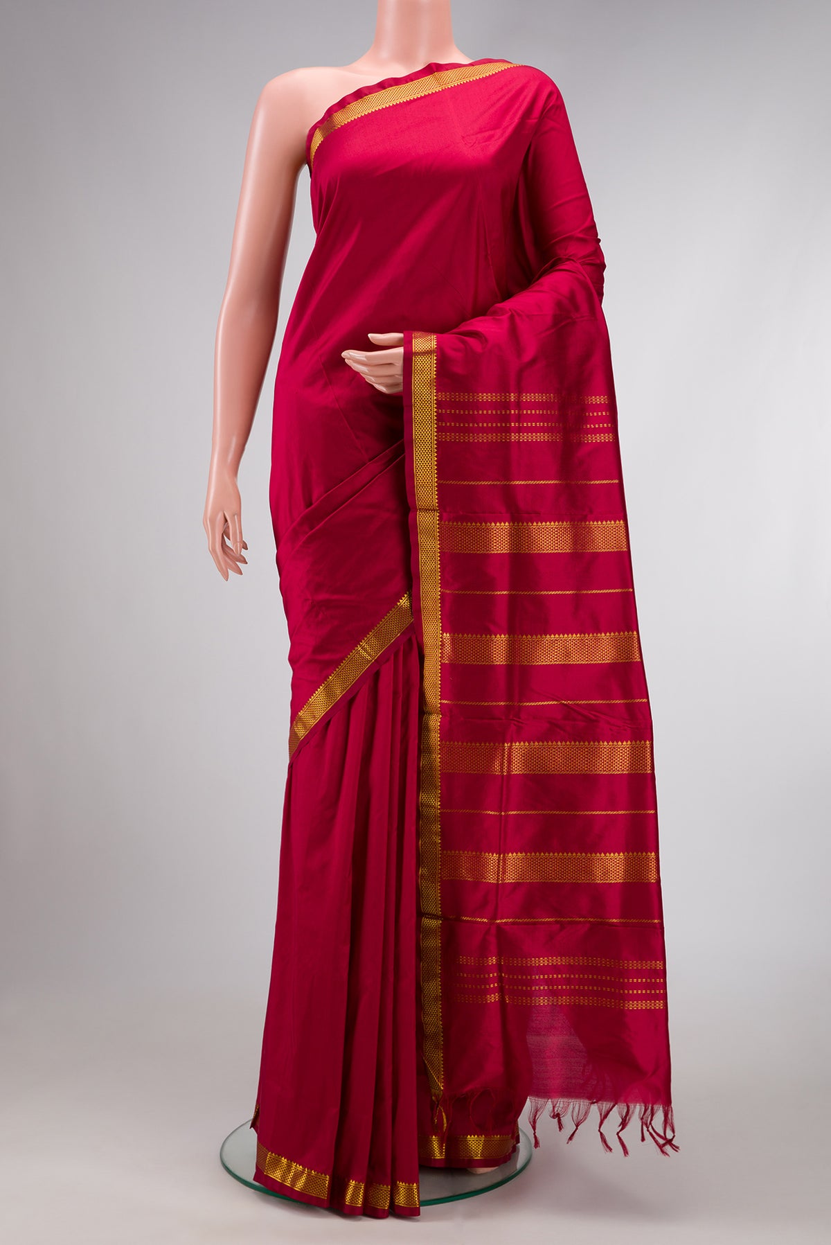 Maroon Dual Tone Kanjivaram Silk Nine Yards Saree with Plain Body and Zari Border.  displayed on a mannequin