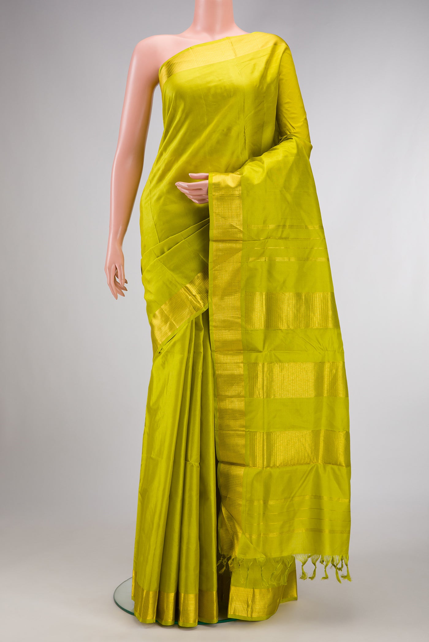Parrot Green Dual Tone Kanchipuram Silk Nine Yards Saree with Plain Body and Zari Border.  displayed on a mannequin