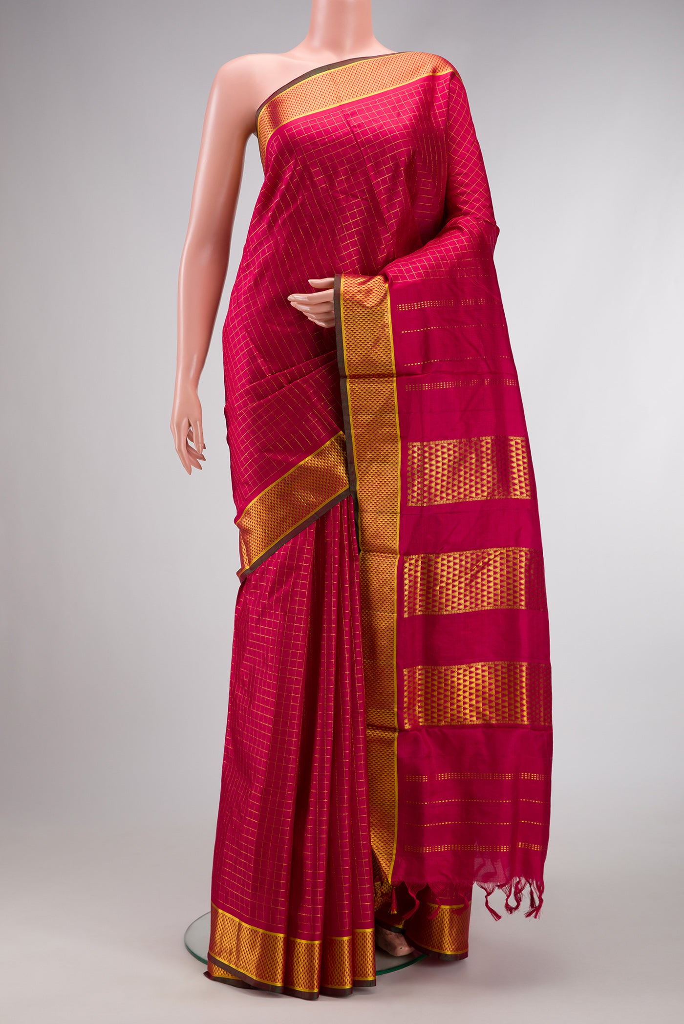 Red Dual Tone Kanchipuram Silk Saree with Checked design on the body and Zari Border.  displayed on a mannequin