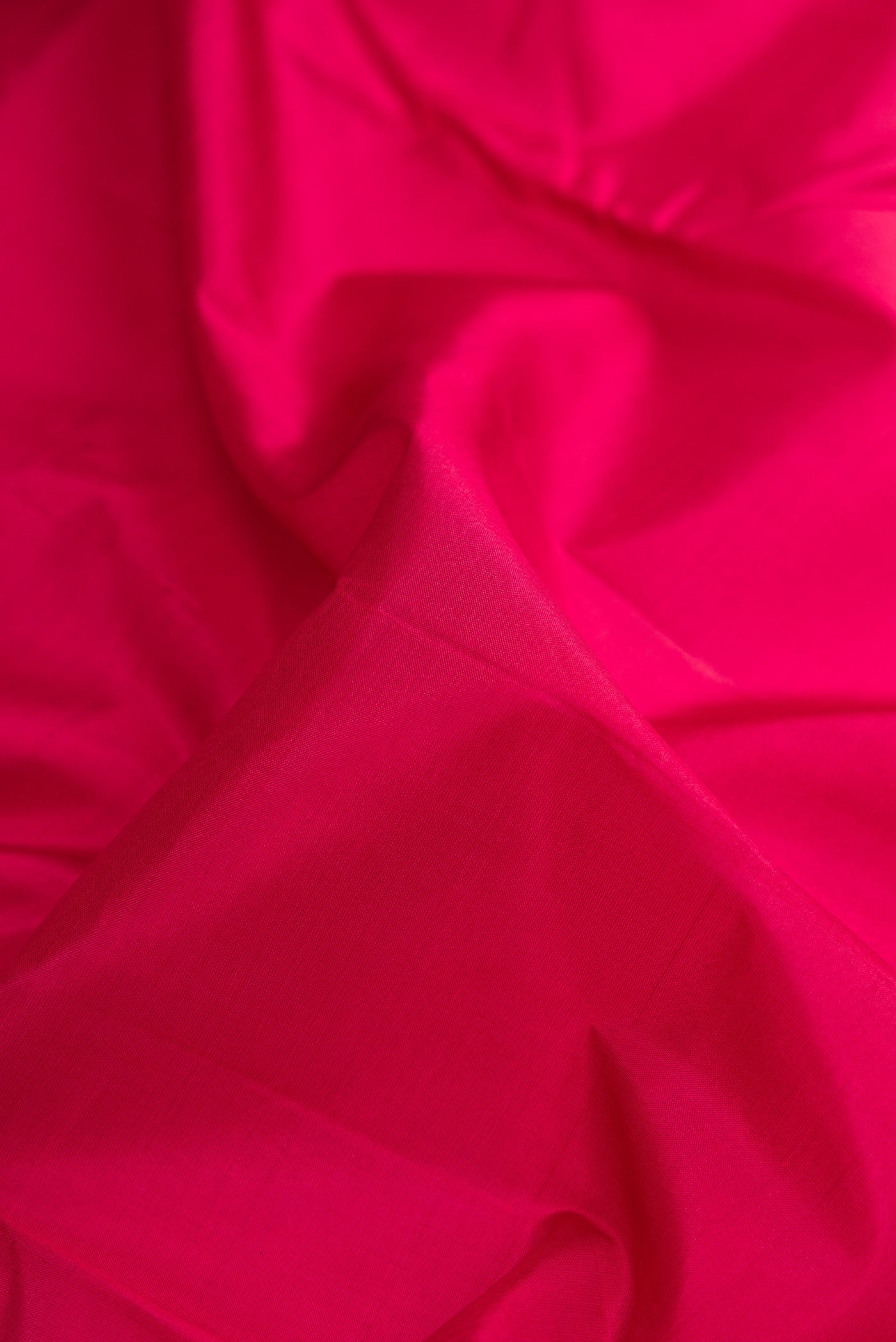 Close up of Maroon Dual Tone Kanchipuram Silk Nine Yards Saree with Plain Body and Zari Border.  displaying folds