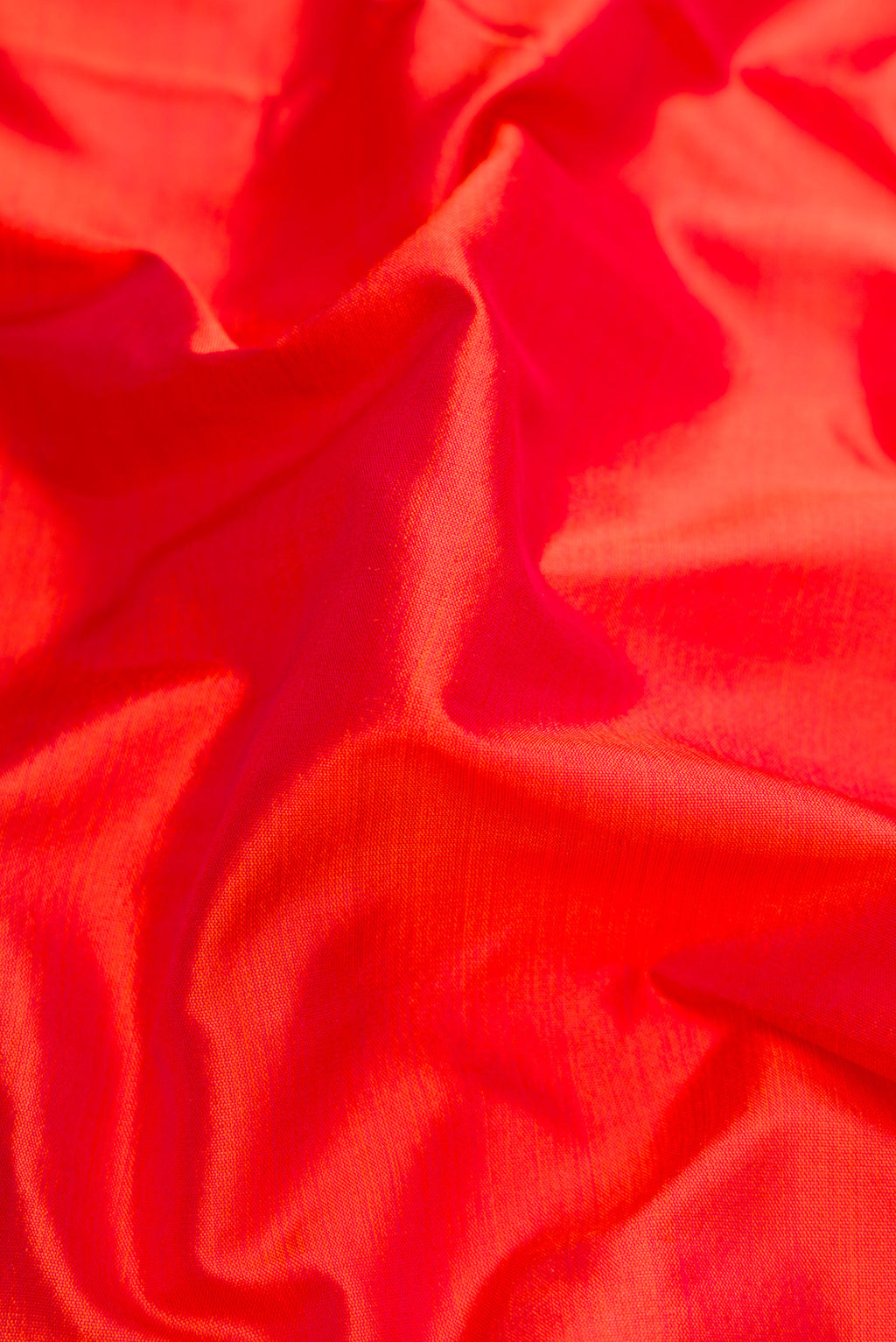 Close up of Orange Dual Tone Kanchipuram Silk Nine Yards Saree with Plain Body and Zari Border.  displaying folds
