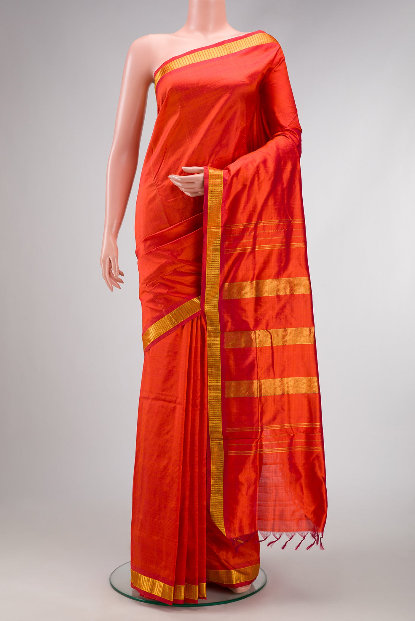 Orange Dual Tone Kanchipuram Silk Nine Yards Saree with Plain Body and Zari Border.  displayed on a mannequin
