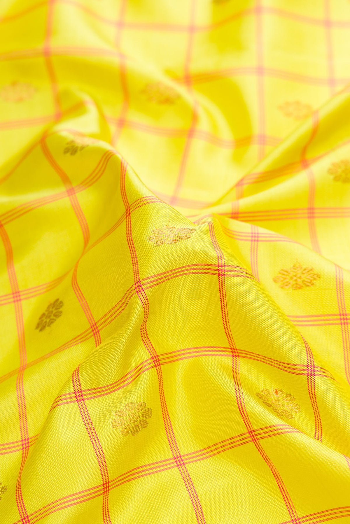 Close up of Parrot Green Dual Tone Gadwal Silk Saree with Checked design on the body and Zari Border.  displaying folds
