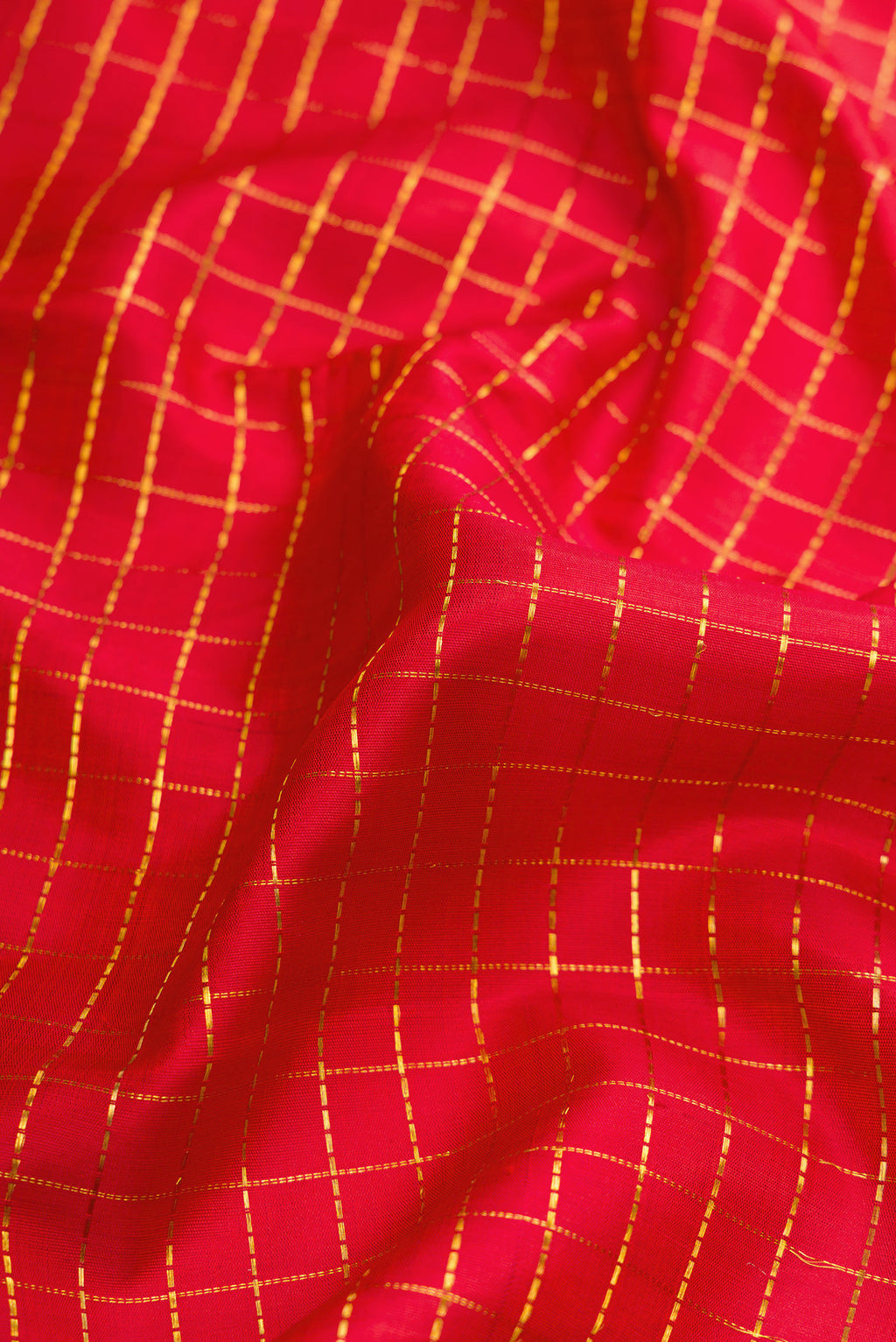 Close up of Red Dual Tone Kanchipuram Silk Nine Yards Saree with Checked design on the body and Zari Border.  displaying folds