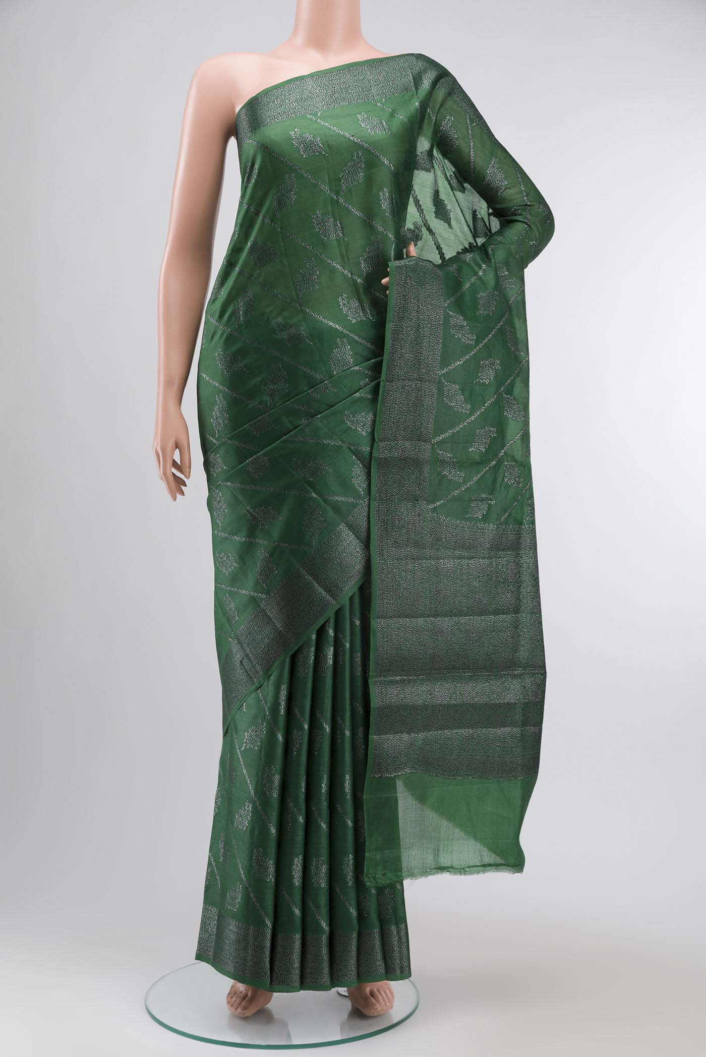 Green Banarasi Tussar Silk Saree with Zari And Thread Butta on the body and Zari And Thread Border displayed on a mannequin