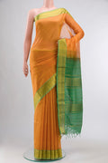 Mustard Silk Cotton Saree with Plain Body and Zari Border displayed on a mannequin