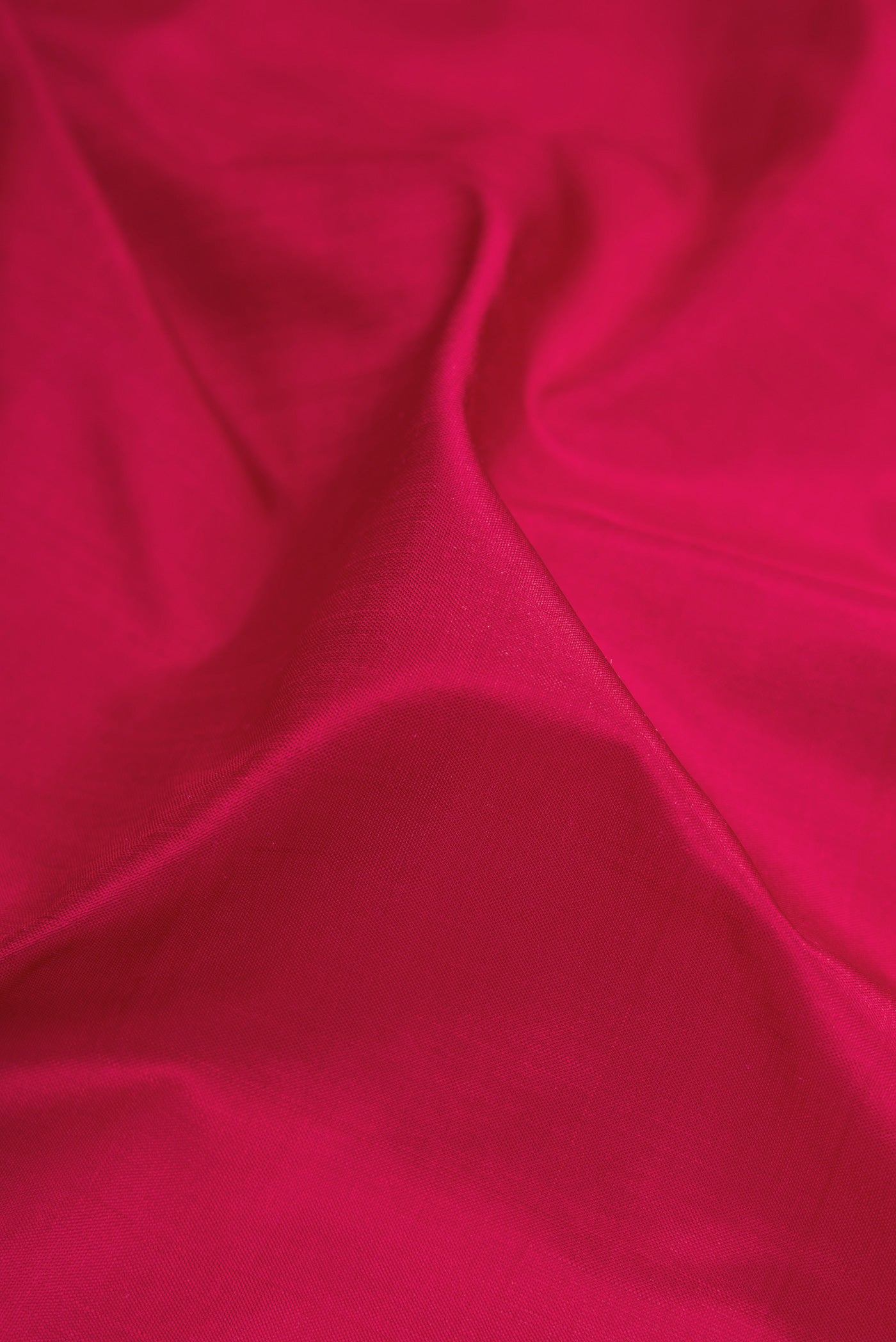 Close up of Maroon Kanjivaram Silk Nine Yards Saree with Plain Body and Zari Border.  displaying folds