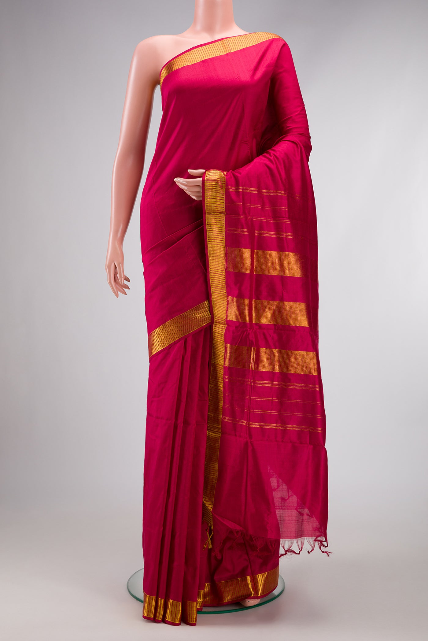 Maroon Kanjivaram Silk Nine Yards Saree with Plain Body and Zari Border.  displayed on a mannequin