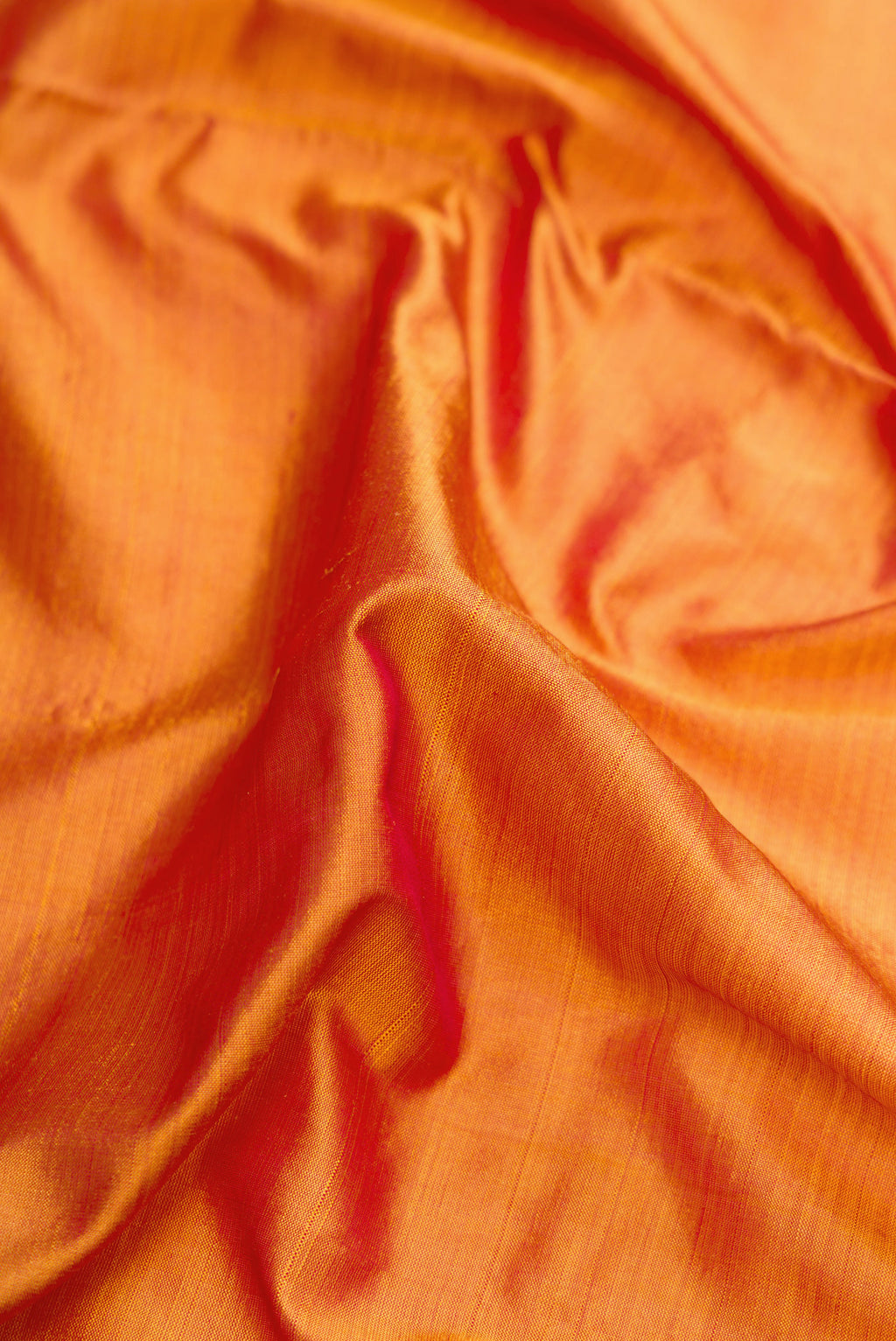 Close up of Mustard Dual Tone Kanjivaram Silk Nine Yards Saree with Plain Body and Zari Border.  displaying folds