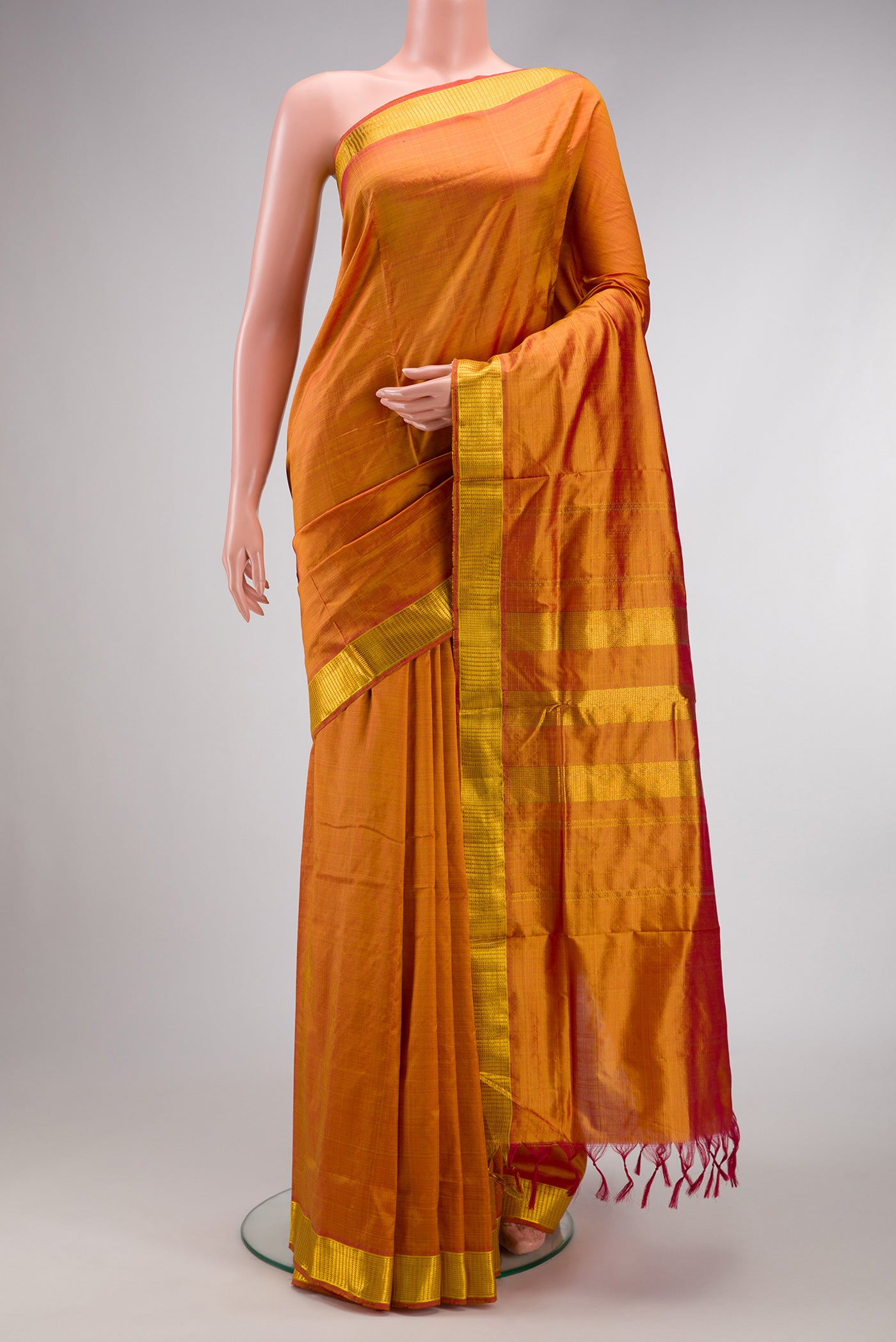 Mustard Dual Tone Kanjivaram Silk Nine Yards Saree with Plain Body and Zari Border.  displayed on a mannequin