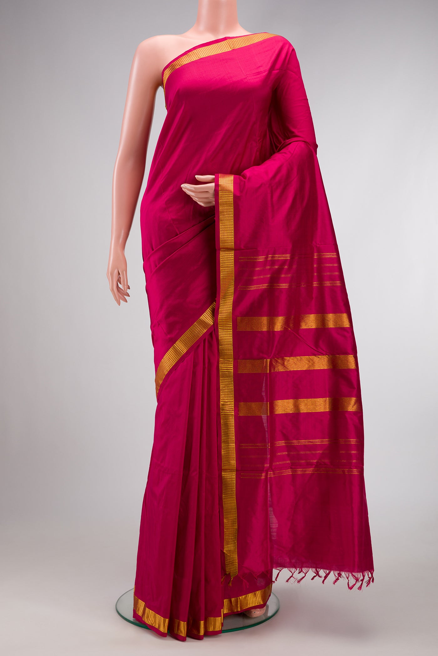 Magenta Dual Tone Kanjivaram Silk Nine Yards Saree with Plain Body and Zari Border.  displayed on a mannequin
