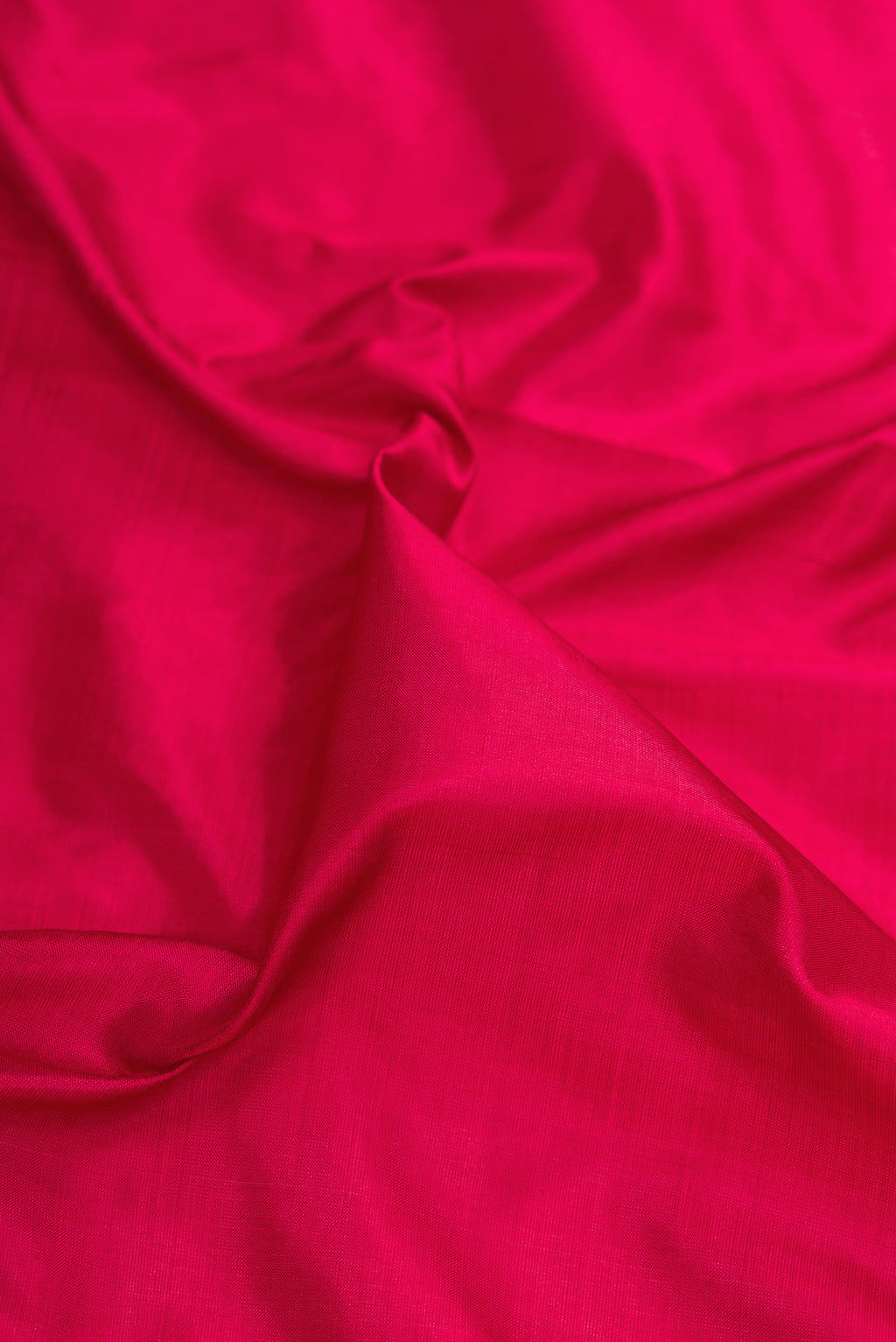 Close up of Maroon Kanchipuram Silk Nine Yards Saree with Plain Body and Zari Border.  displaying folds