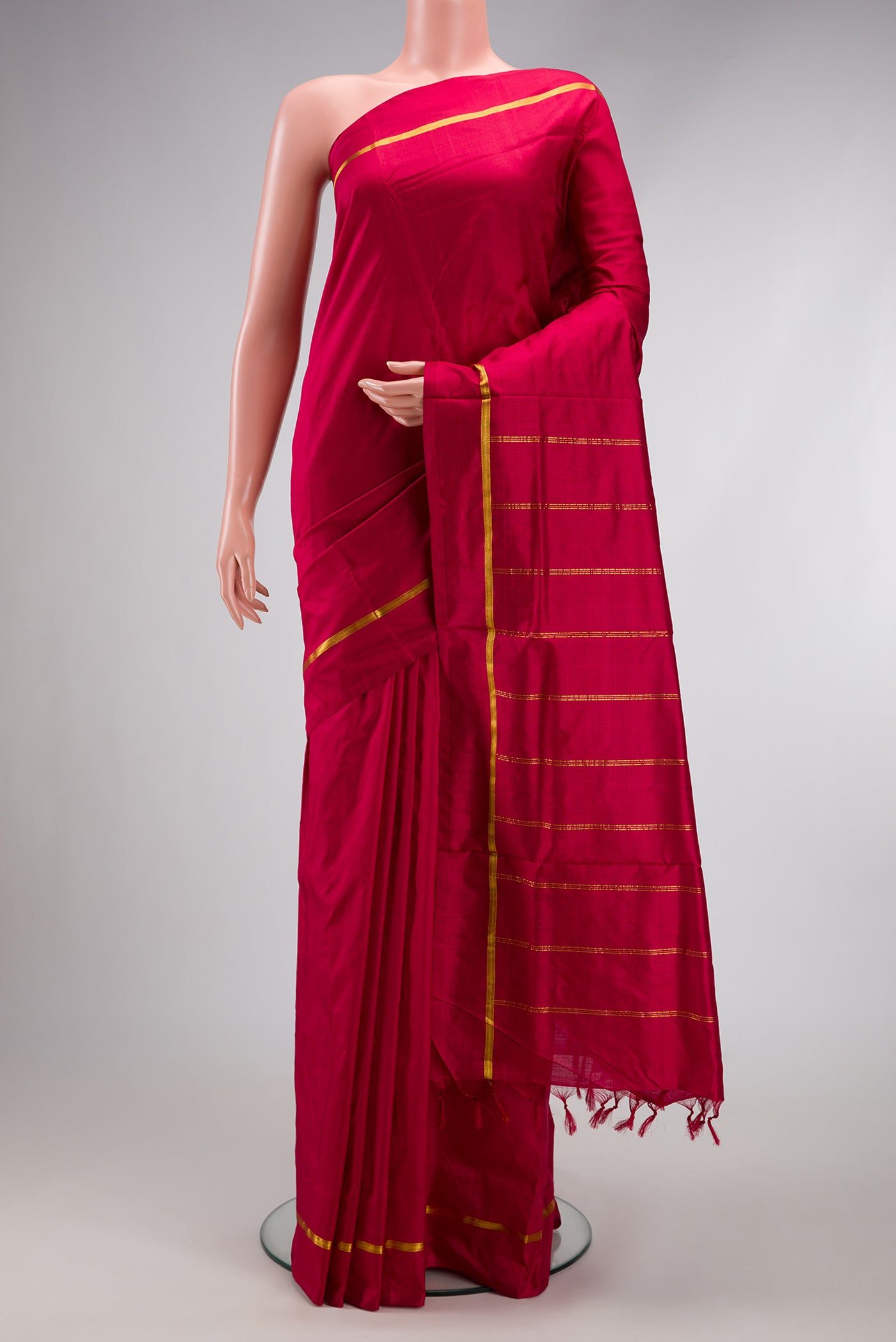 Maroon Kanchipuram Silk Nine Yards Saree with Plain Body and Zari Border.  displayed on a mannequin