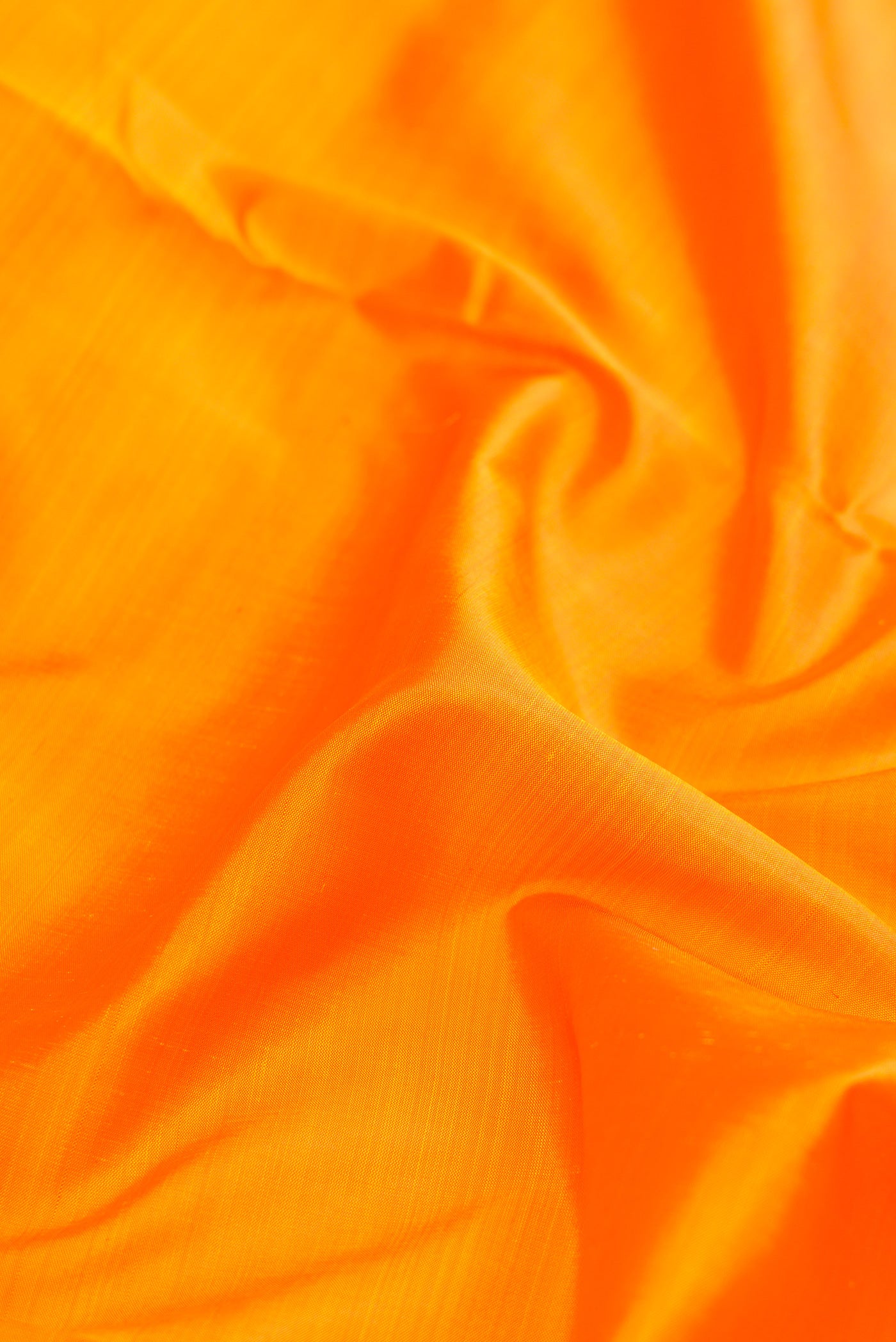 Close up of Pure Silk Pure Zari Yellow Dual Tone Kanchipuram Nine Yards Saree with Plain Body and Zari Border.  displaying folds