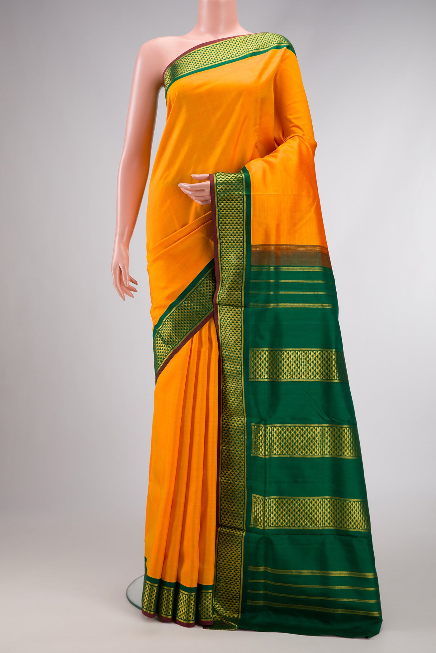 Pure Silk Pure Zari Yellow Dual Tone Kanchipuram Nine Yards Saree with Plain Body and Zari Border.  displayed on a mannequin