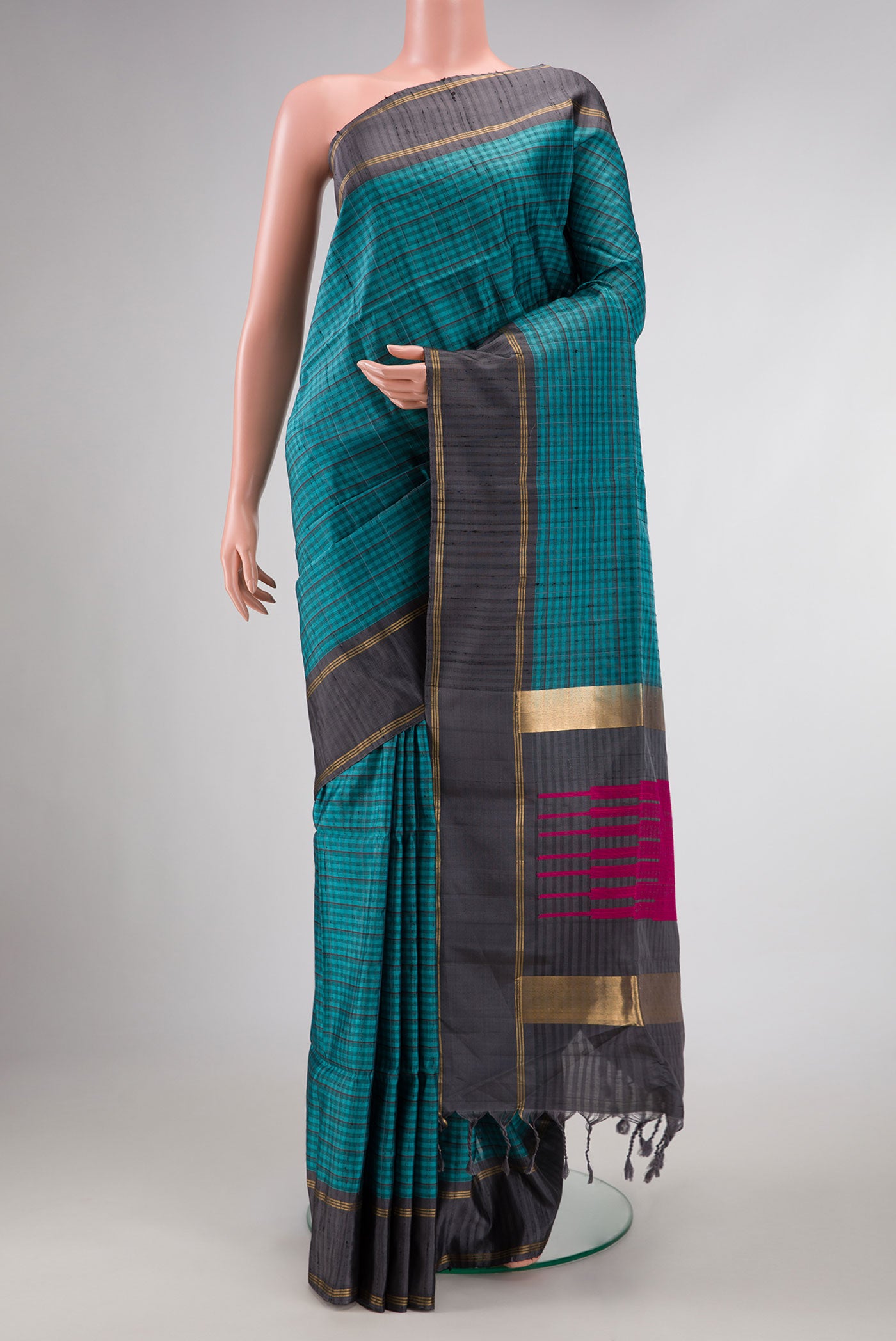 Maya Blue Dual Tone Soft Silk Saree with Checked design on the body and Zari Border displayed on a mannequin