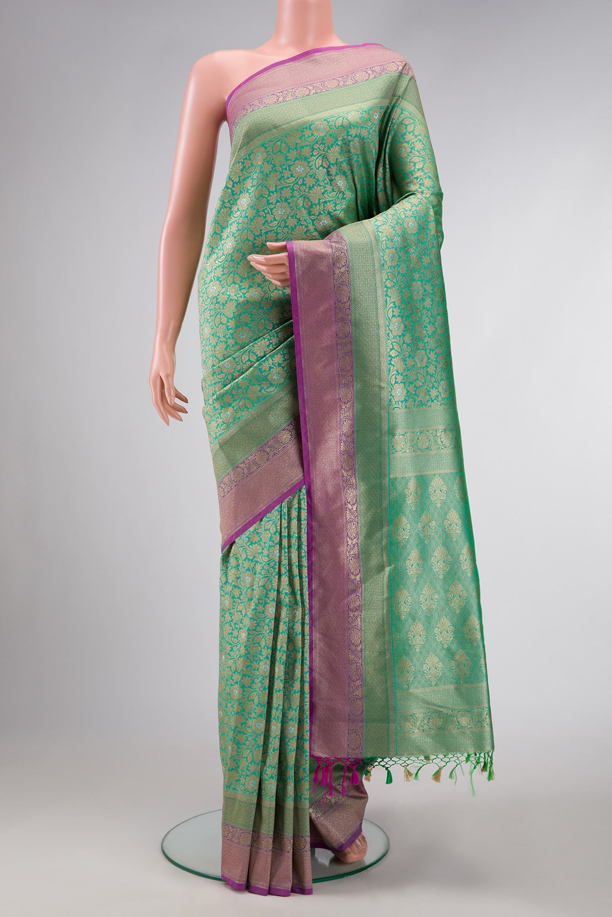 Sea Green Dual Tone Blended Banarasi Silk Saree with Zari Brocade on the body and Zari Border.  displayed on a mannequin